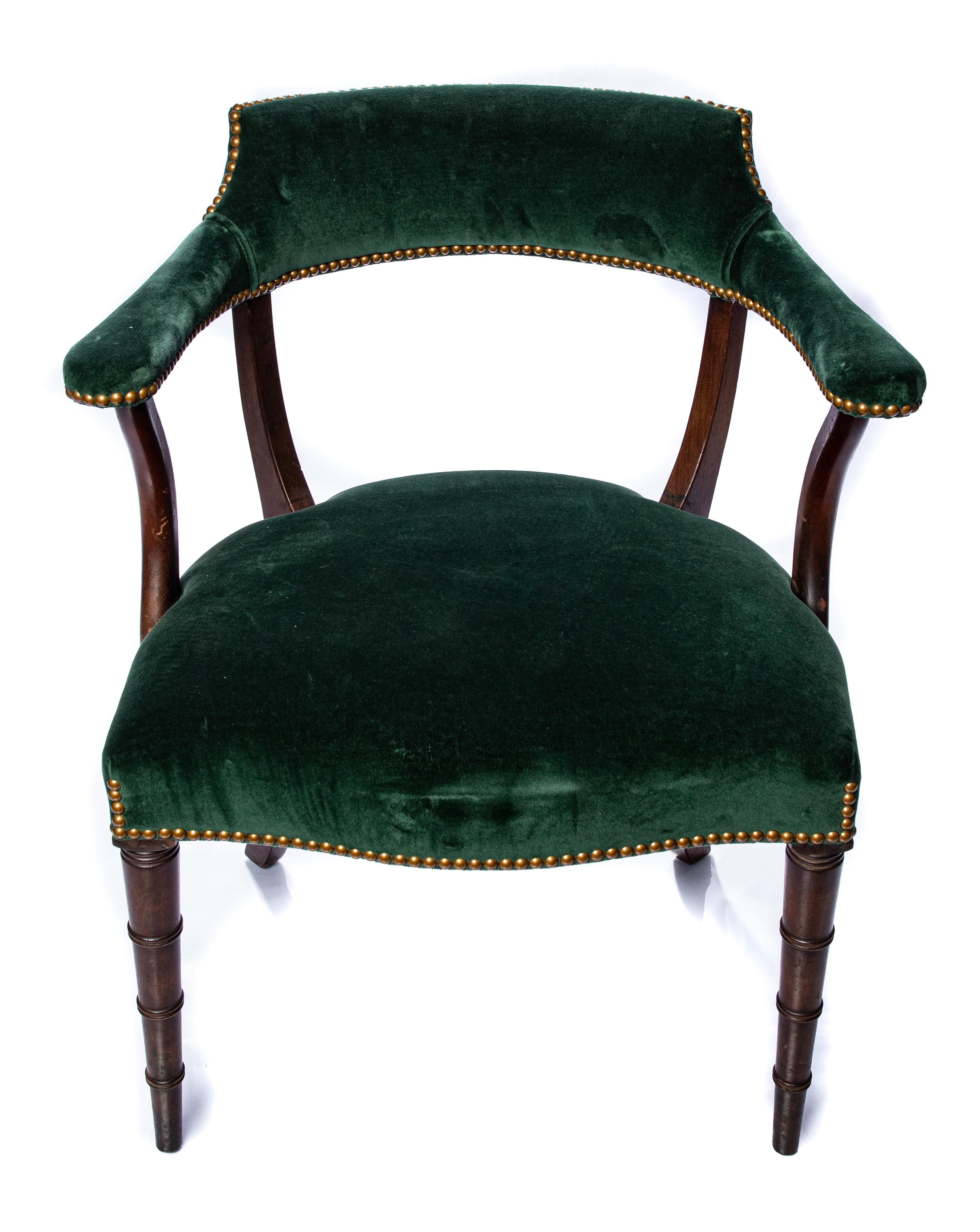 Offering 2 pairs of these Chippendale armchairs. Covered in a lovely dark green velvet, with brass tacks. The two front legs are turned Chippendale legs rising up to the seat. The back and arms are covered in the same green velvet with brass tacks.