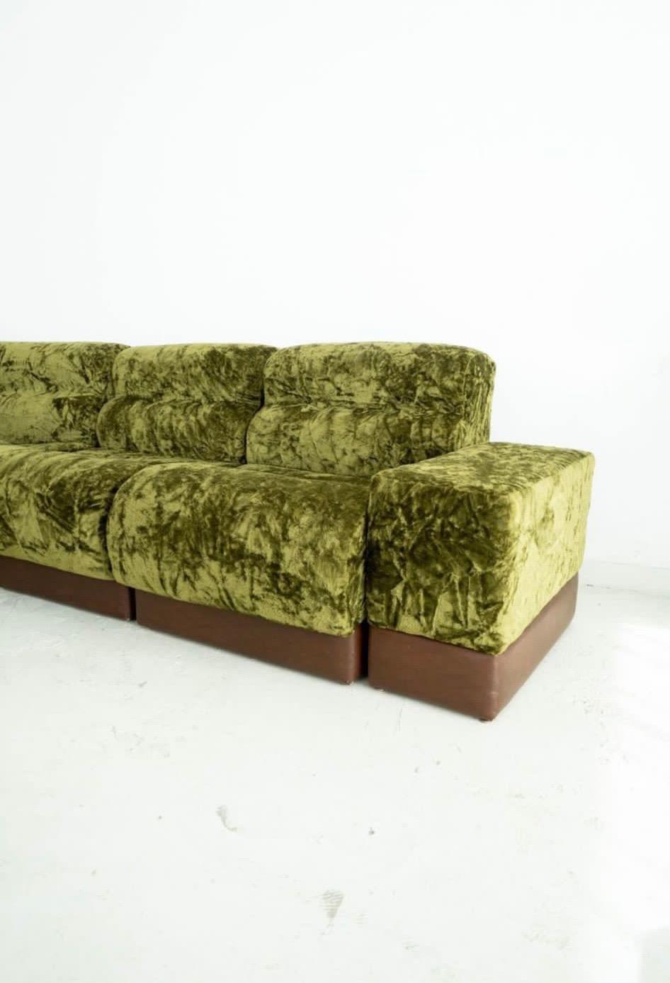 Nice green velvet modular sofa with many possibilities. You can combine as you want, each section could be shown as a simple lounge chair. The corner also could be presented where you want to have a different shape of sofa. Amazing original green