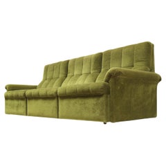 Green velvet vintage element sofa made in the 1970s