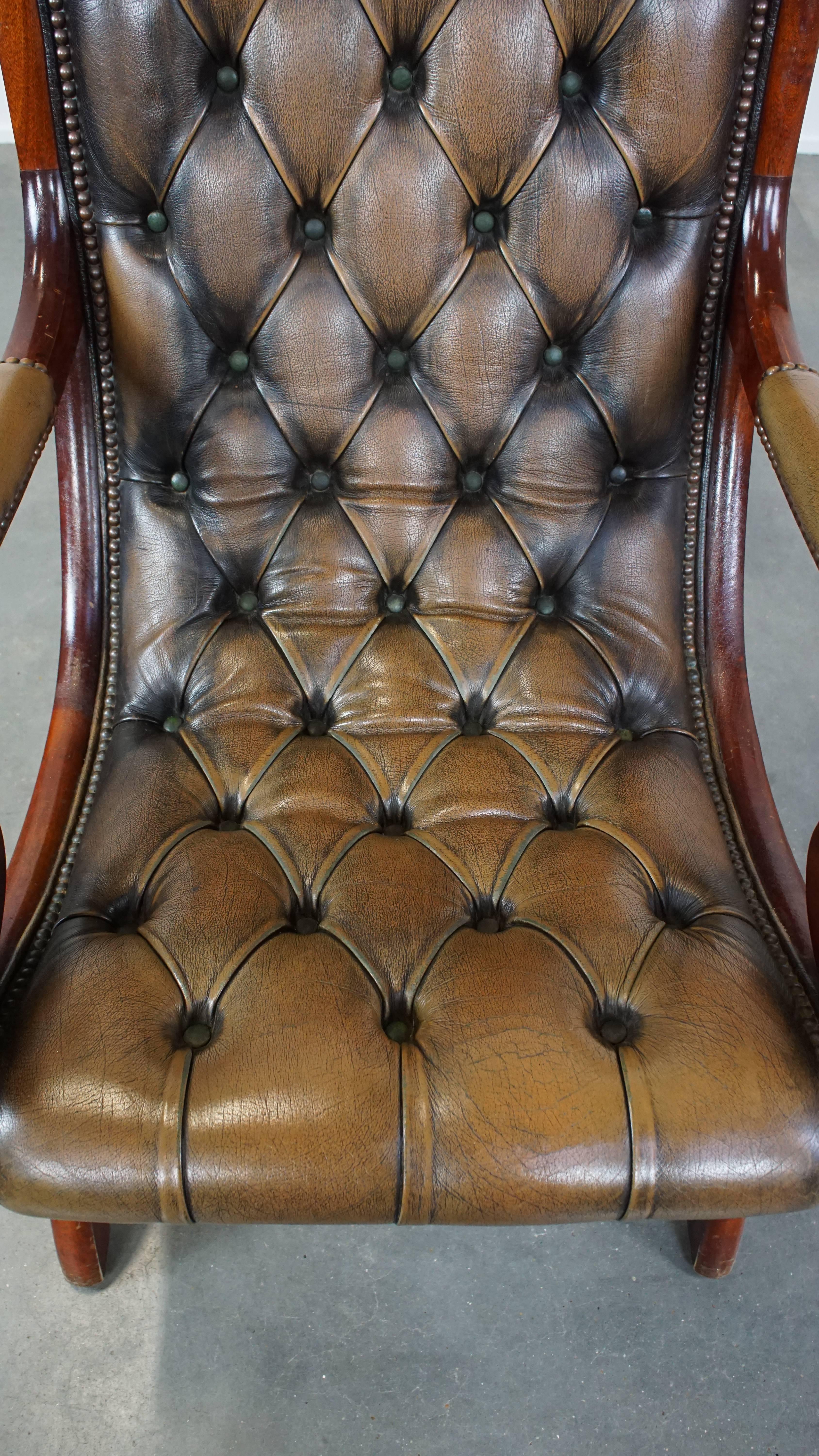 Cowhide Green Vintage English Chesterfield Armchair with Elegant Design and Wood Accents For Sale