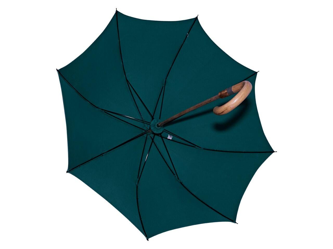 Product details:  Vintage green umbrella by Hermes.  Snap strap closure.  Wooden hook handle.  35