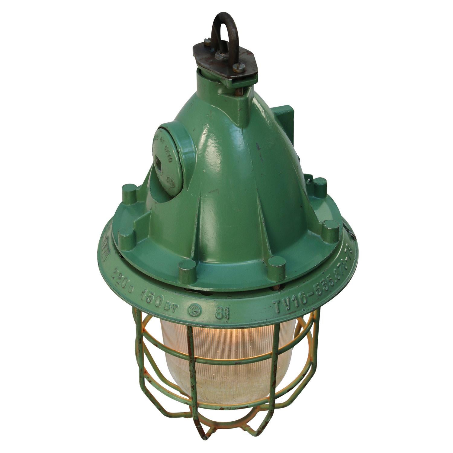 Green industrial lamp
Aluminum top, metal cage with clear half striped glass.

Weight: 3.80 kg / 8.4 lb

Priced per individual item. All lamps have been made suitable by international standards for incandescent light bulbs, energy-efficient and