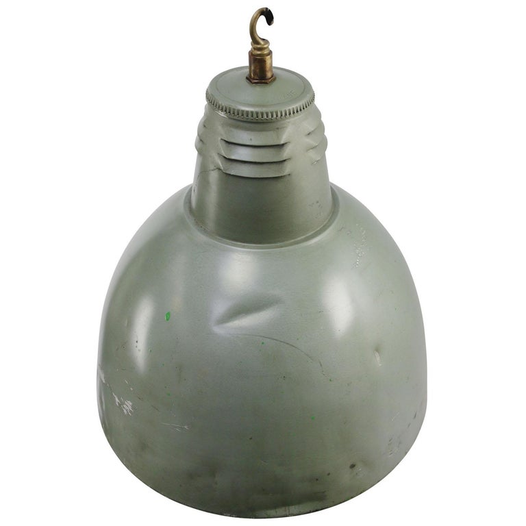 Industrial pendant lamp by Holophane Paris
Green metal shade with clear striped / holophane glass
Brass top

weight 5.80 kg / 12.8 lb

Priced per individual item. All lamps have been made suitable by international standards for incandescent
