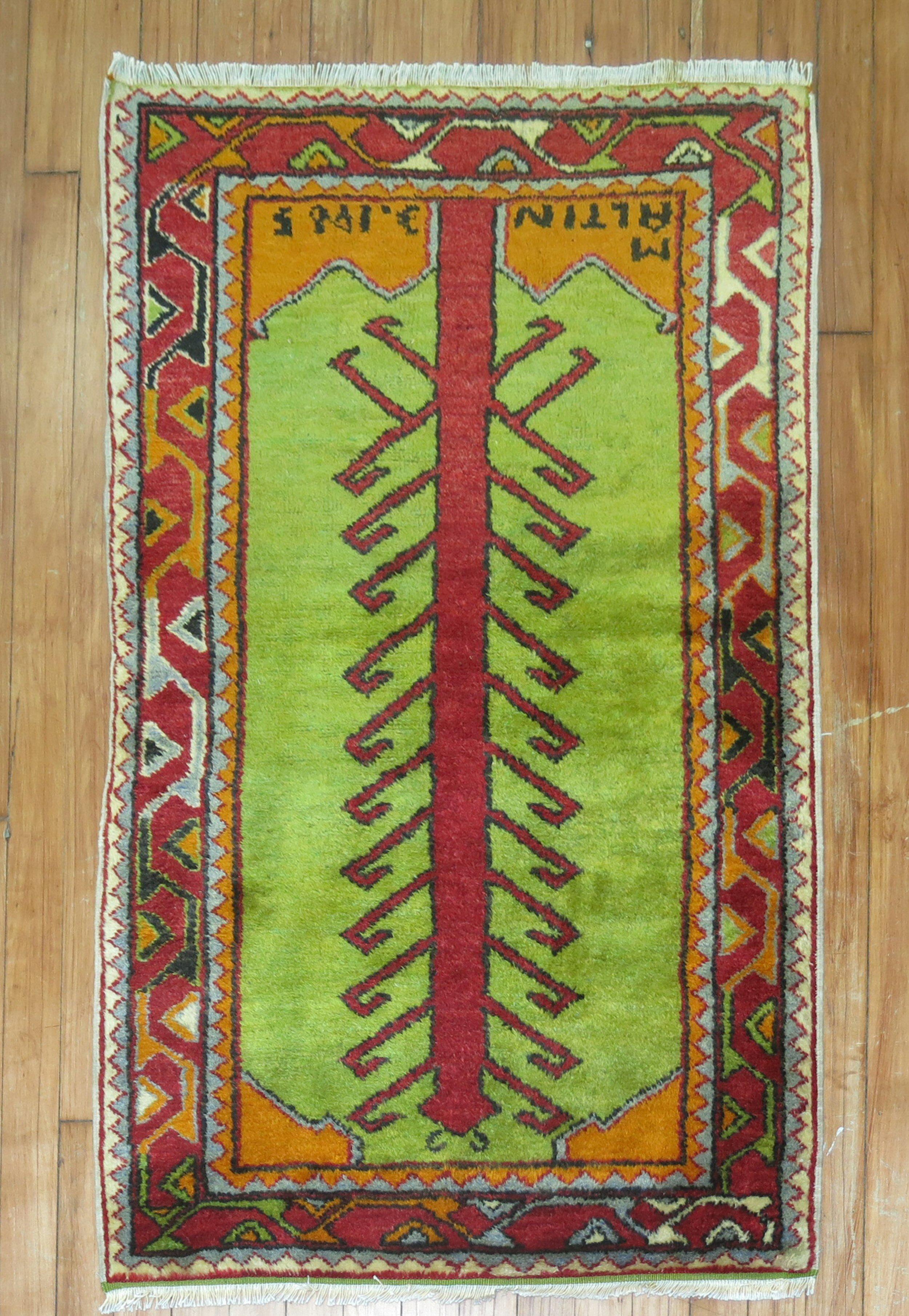 Full pile Turkish Anatolian Tribal rug in green, dated 1985 and signed by weaver

circa 1940. Measures: 2'4'' x 3'9''.
