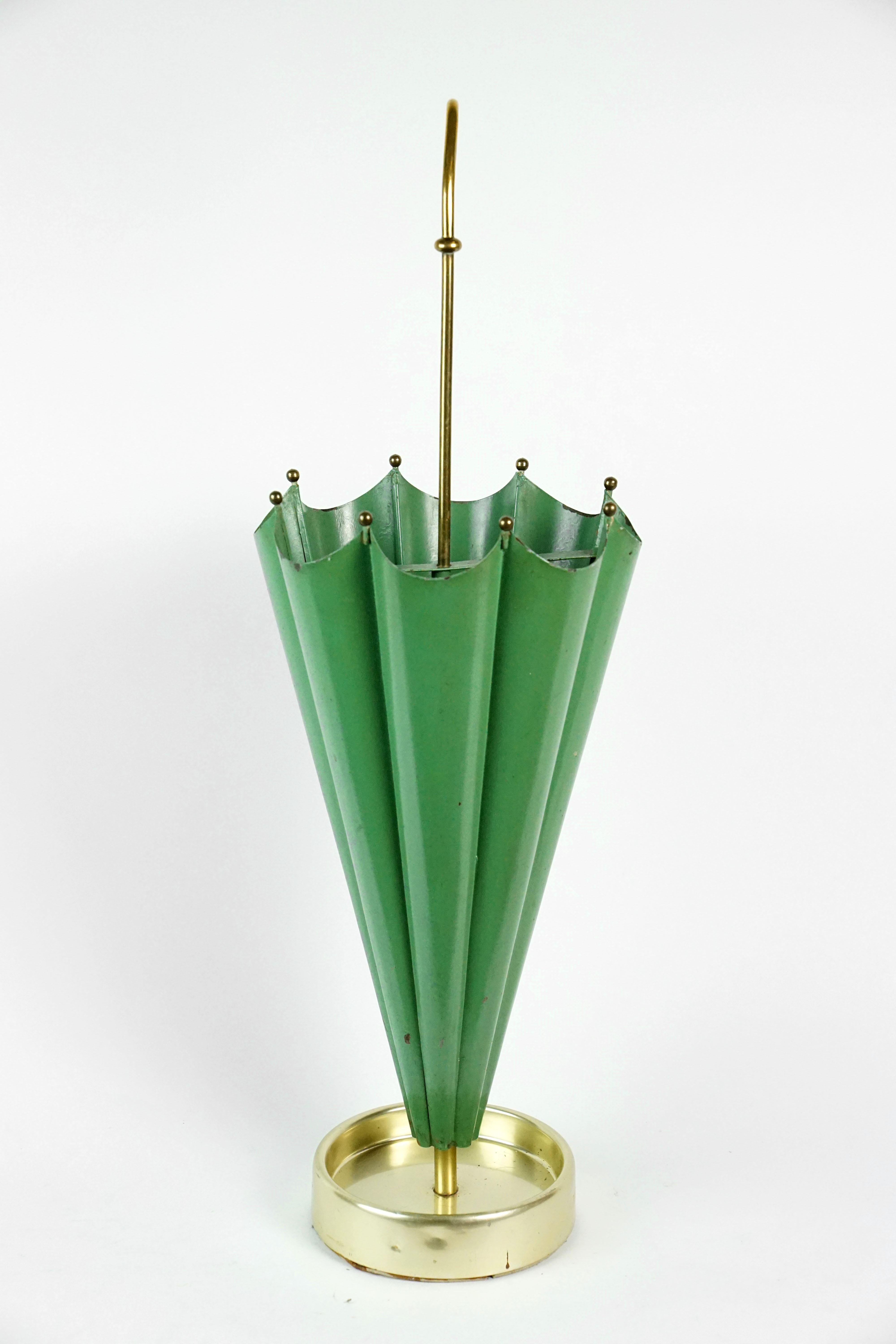 Mid-Century Modern umbrella stand, brass colored, shaped like an umbrella, 1950s Italy.
Green with brass colored base and handle. Wonderful design!
 