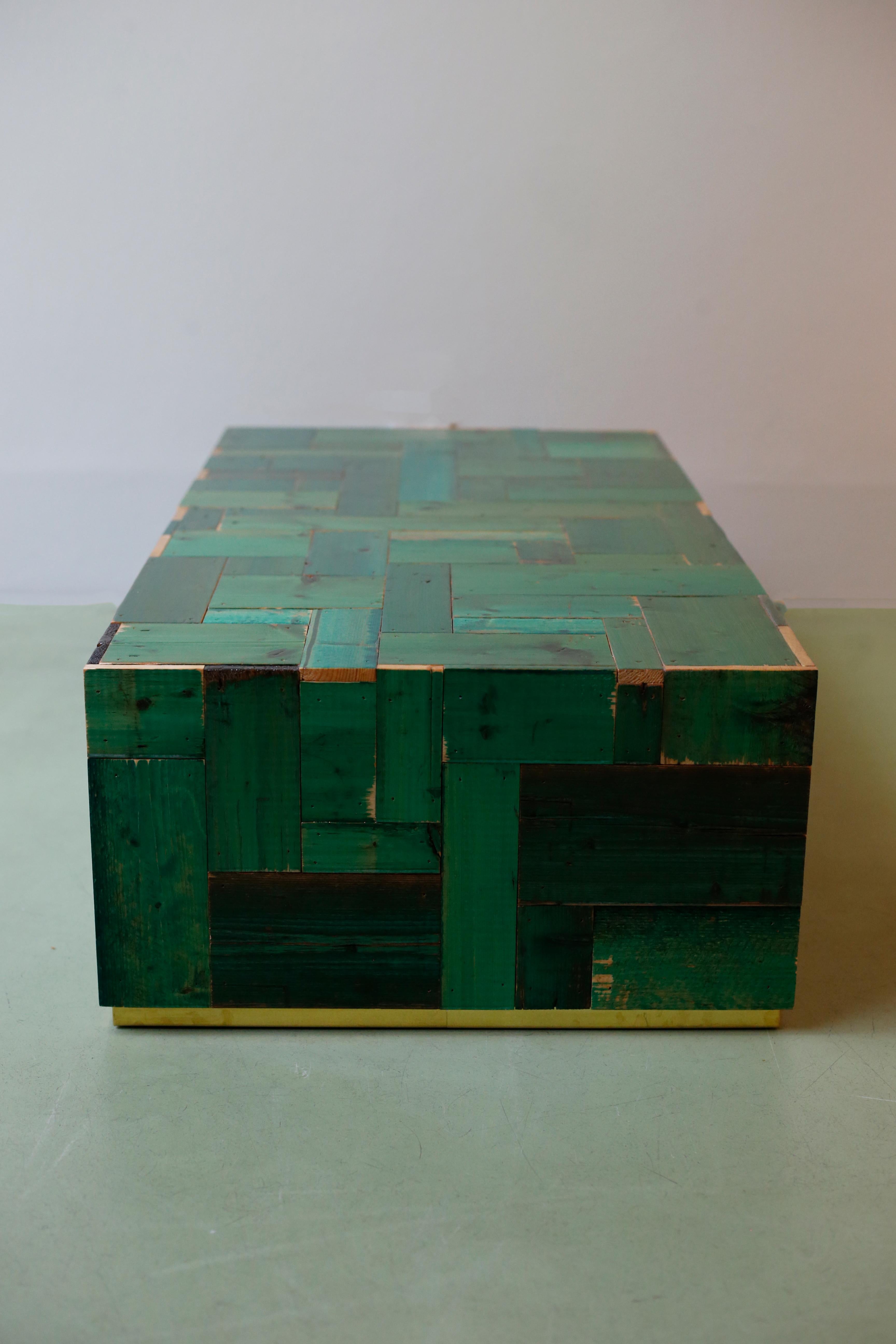 This one of custom made waste coffee cube in scrapwood is a layered coffee table built up of pieces of scrapwood. As a result that this piece of furniture is unique. The waste coffee cube is finished with six layers of glossy two-component lacquer