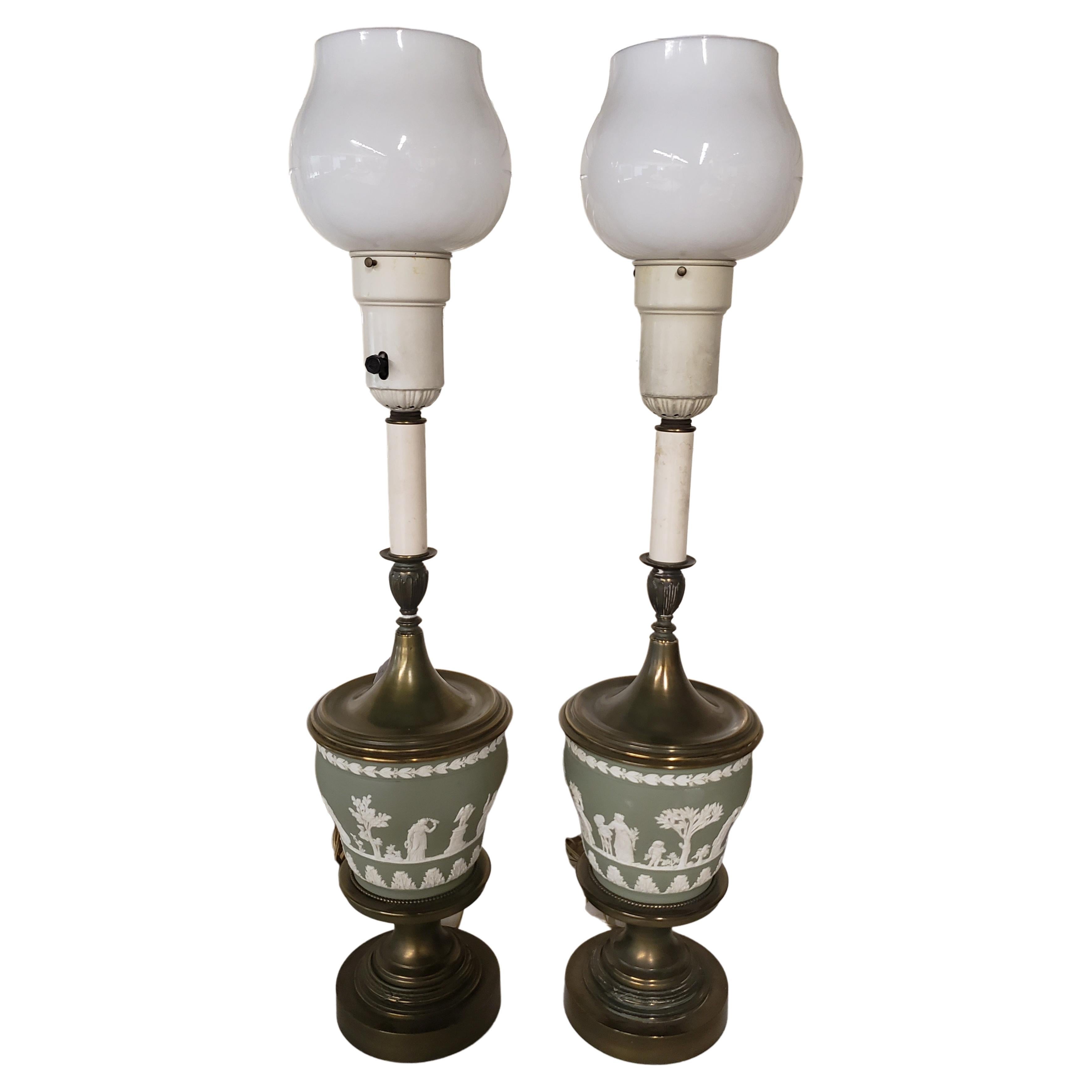 A very rare pair of green /turquoise Wedgewood jasperware torchiere table lamps. Come with glass shades
Measure 7.5 inches in diameter and stand 33