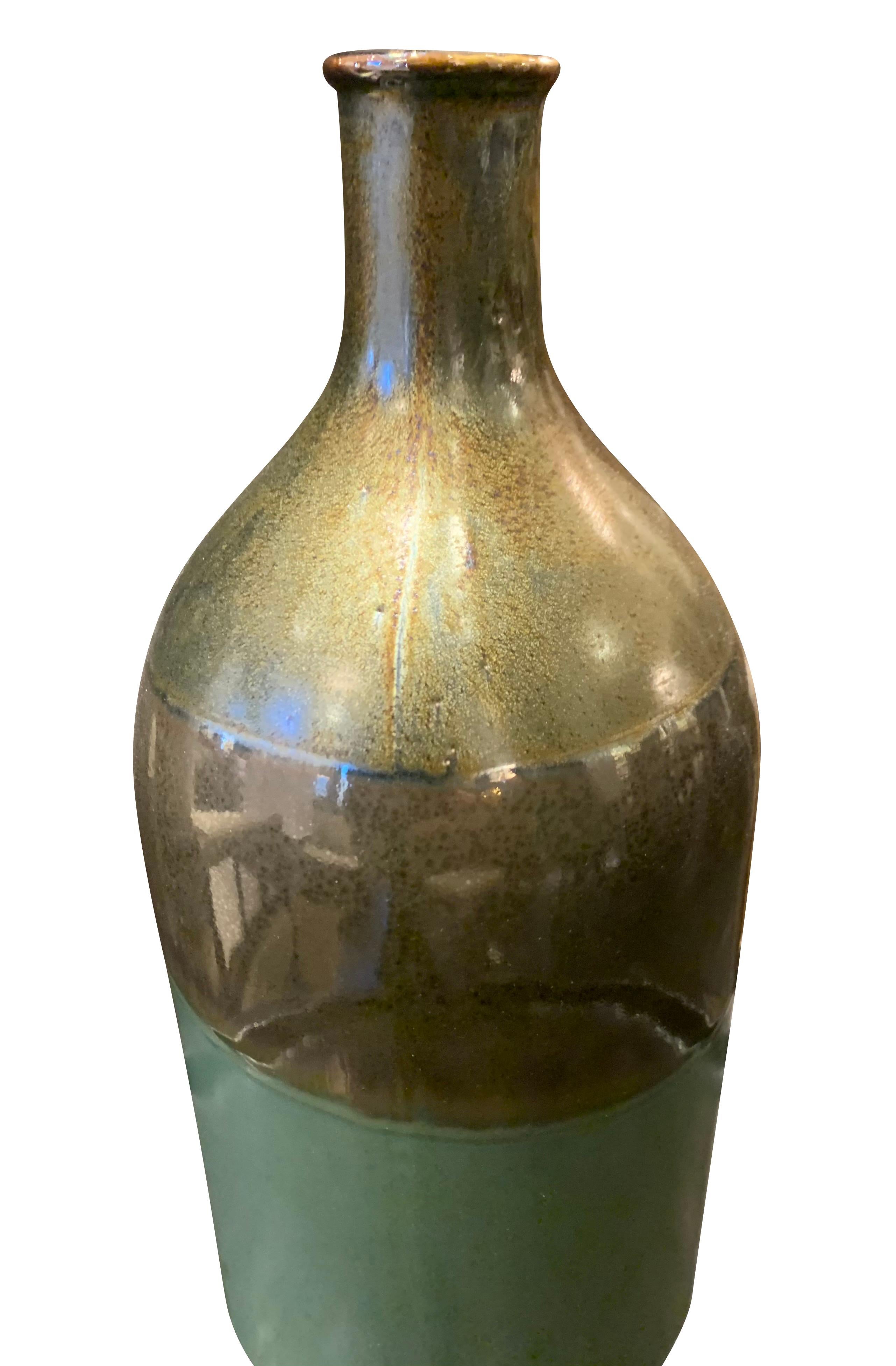 Contemporary Chinese iridescent color block vase.
Horizontal bands of color. Bottom of vase is green.
Middle band is a metallic glaze, top band is an iridescent metallic glaze.
Sits nicely as a collection with S5273/4/6.
See image #4.
 