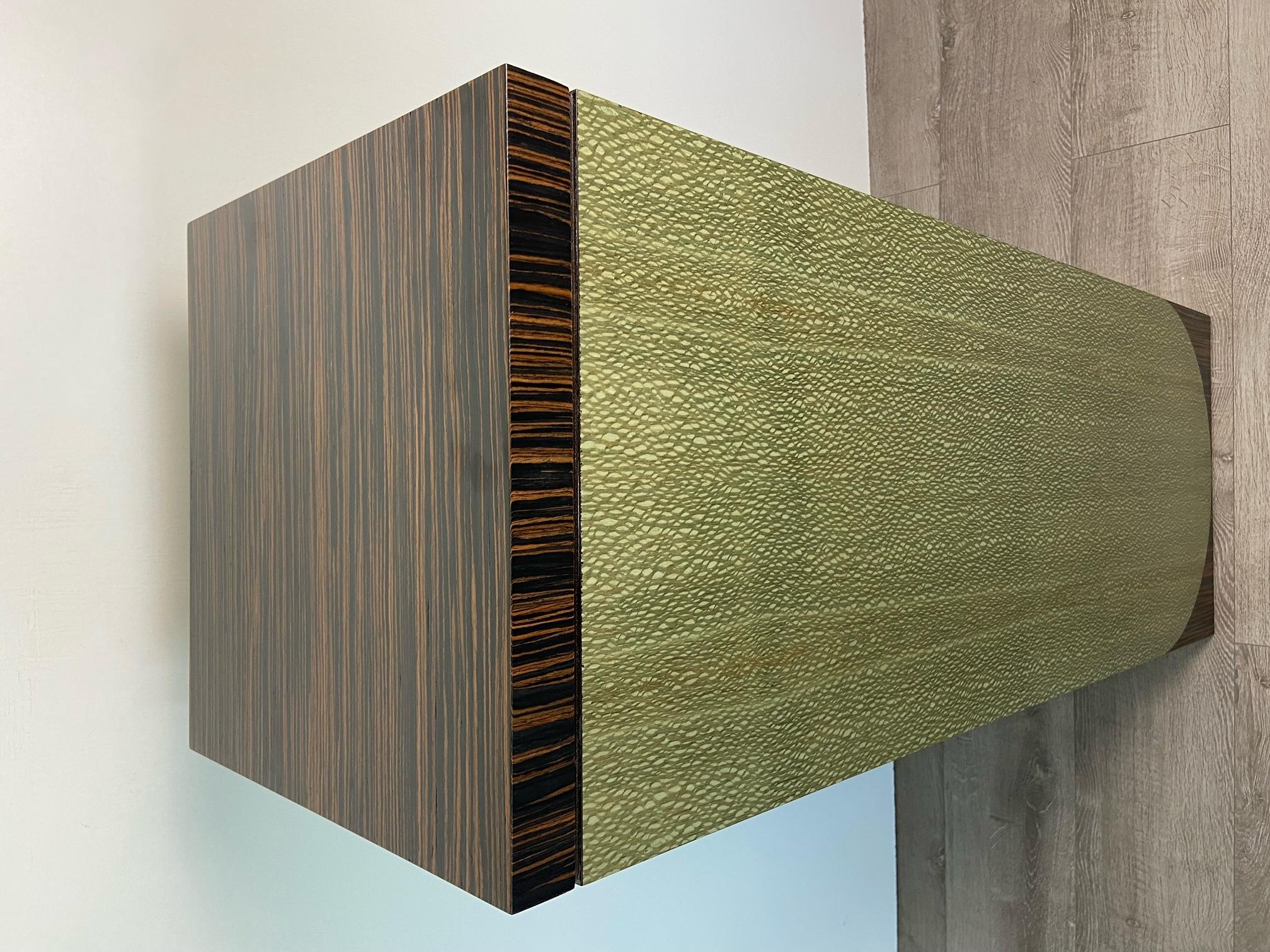 Wood veneer plinth.

As with all our furniture, this plinth is made to order and is therefore highly customisable, including in size and finish. The customisation fee is only 10%, which is added to the retail price.
