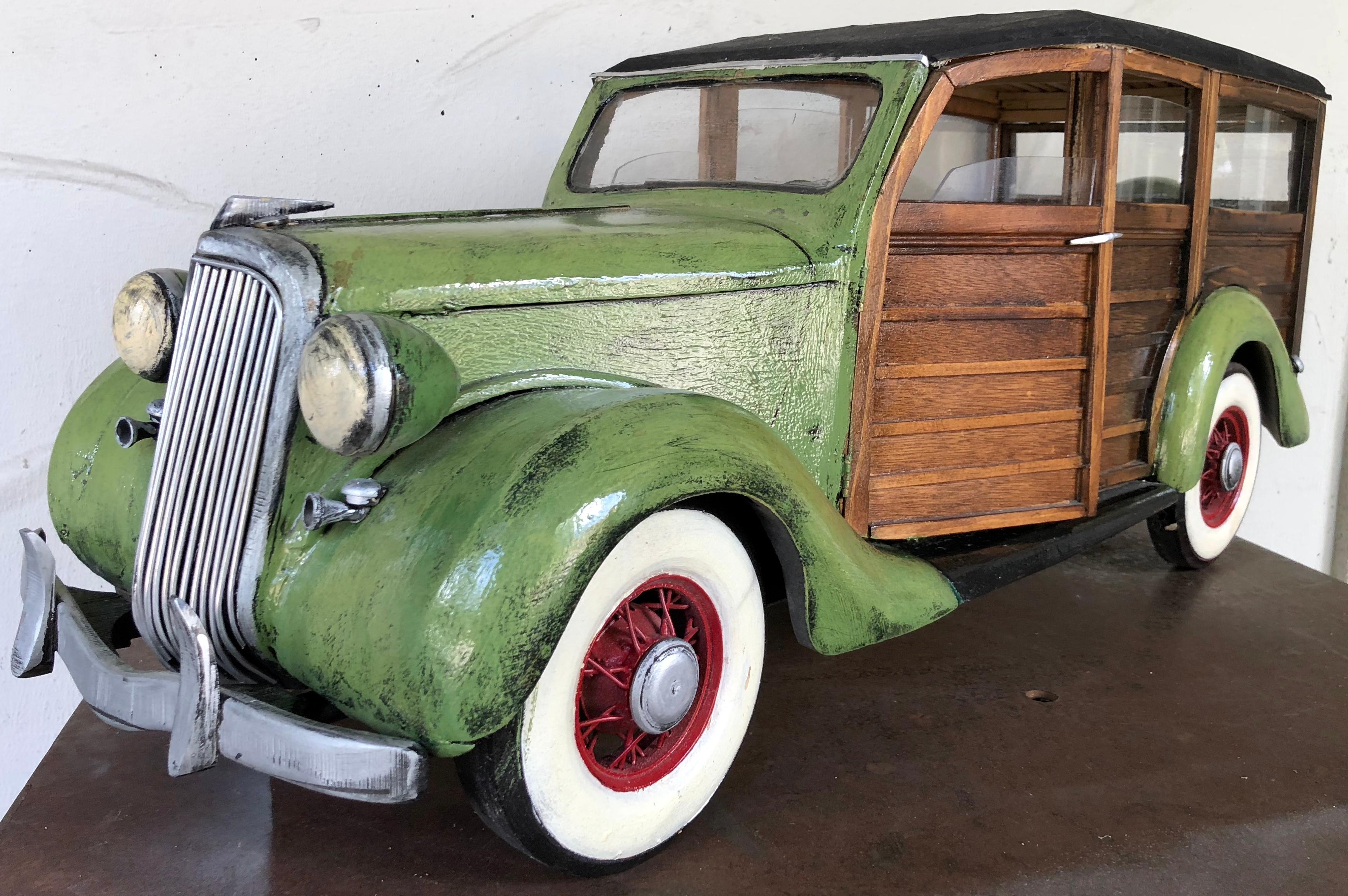 One of a kind large-scale wood and painted sculpture or an iconic car.