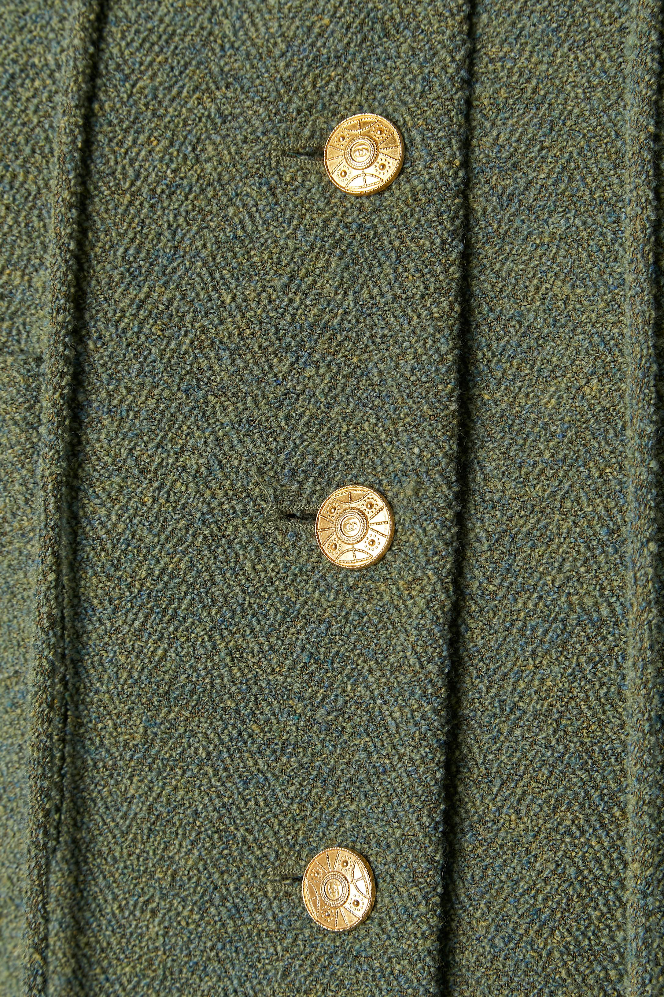 Green wool tweed skirt suit with gold buttons and fur pompoms Chanel Boutique  In Excellent Condition For Sale In Saint-Ouen-Sur-Seine, FR