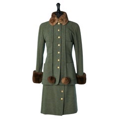 Green wool tweed skirt suit with gold buttons and fur pompoms Chanel Boutique 