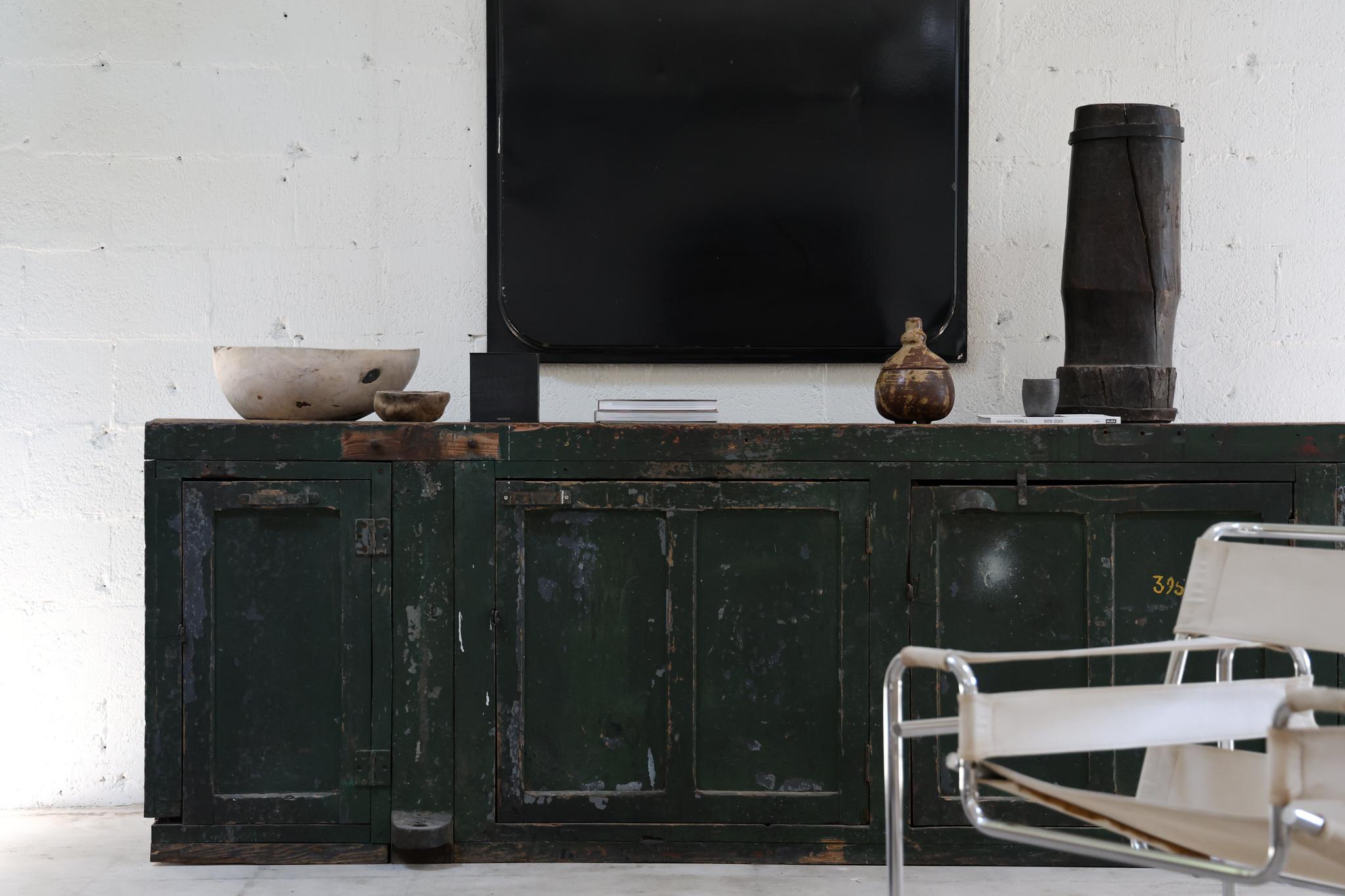 Green workshop console. 

A long wooden console that blends rustic sensibility and stylish moderinity. It can have multiple functions and has a unique character. Purchased from an old workshop. 

Wear consistant with age
