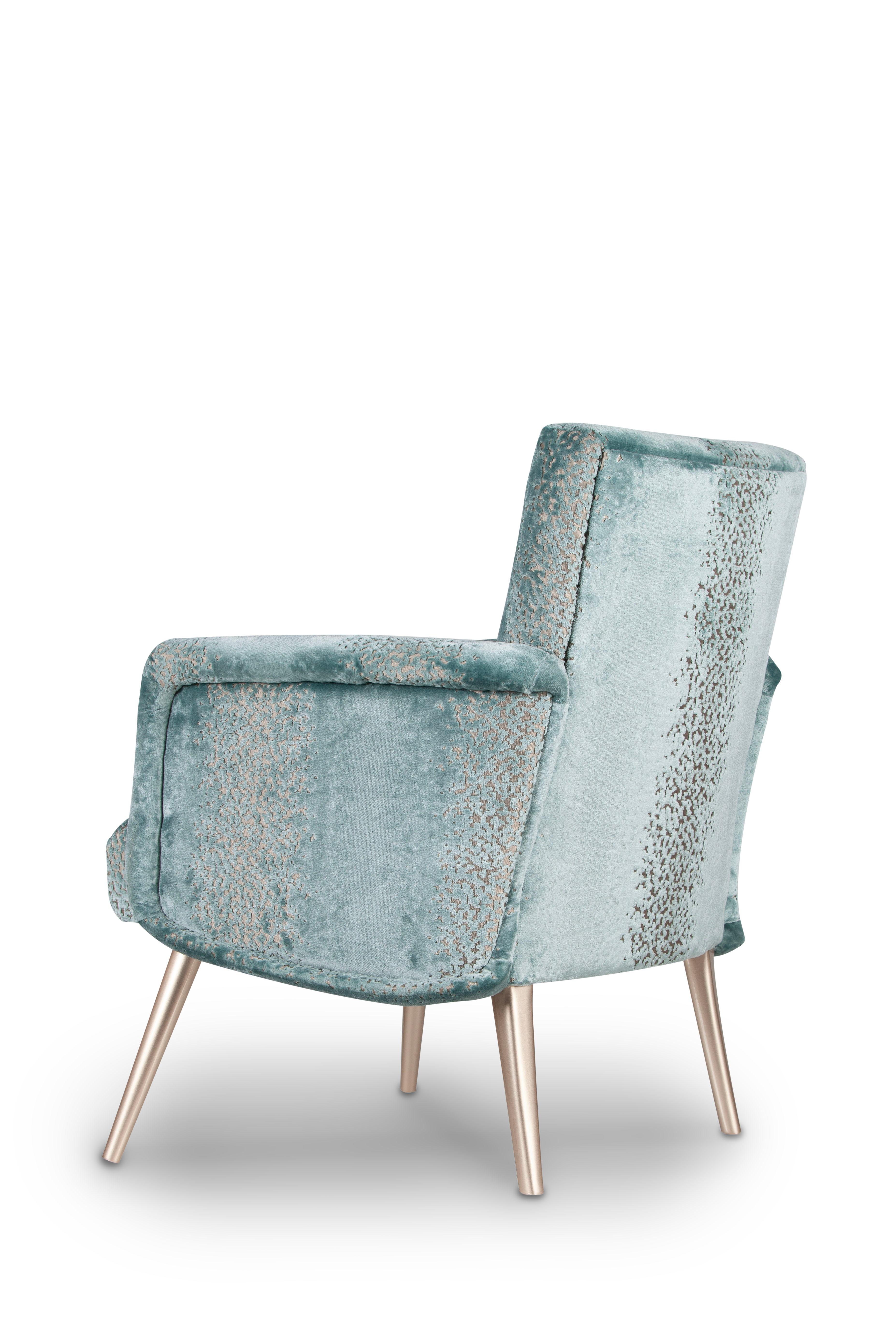 Leo Armchair, Contemporary Collection, Handcrafted in Portugal - Europe by Greenapple.

Leo puts a modern twist on the traditional armchair.
The sumptuous upholstery in mint green velvet goes together effortlessly with the champagne lacquered