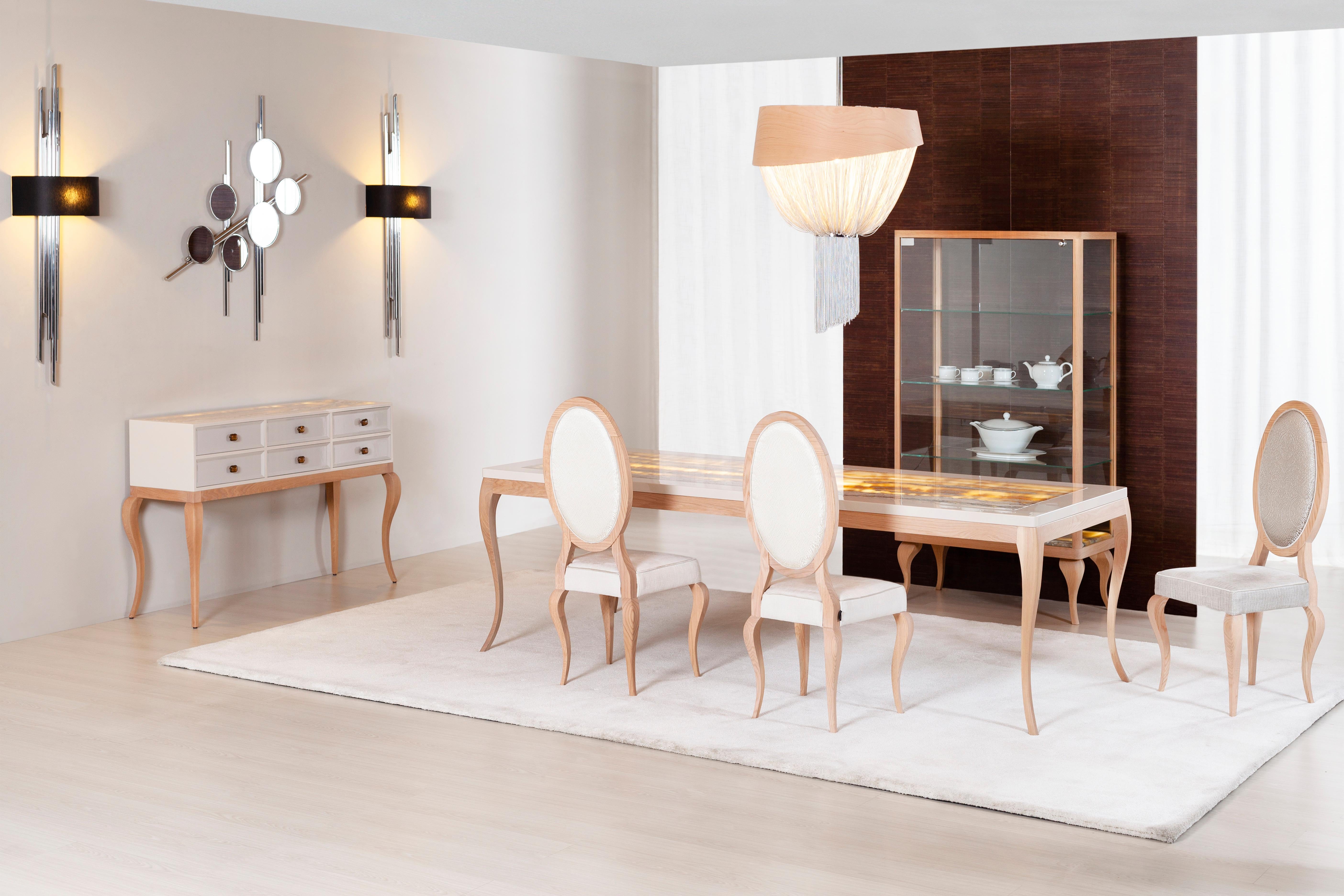 Veneza dining table, Modern collection, handcrafted in Portugal - Europe by GF Modern.

Veneza dining table represents the dawn of a new modern era. The beige table top is enhanced with a stunning shadow onyx inlay, complementing the legs in