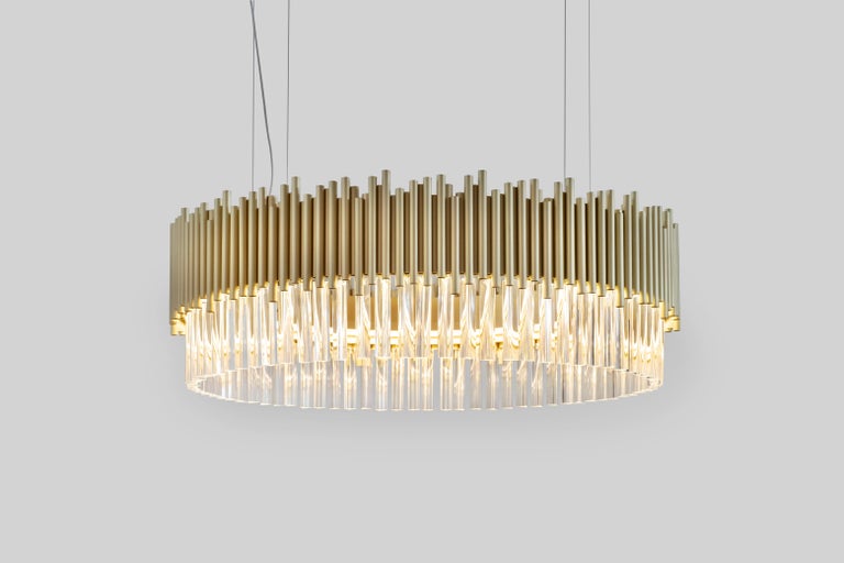 Crown Chandelier, Modern Collection, Handcrafted in Portugal - Europe by GF Modern.

The combination of brushed brass with clear crystal pendants creates a noble shining vibration. This magnificent piece spreads glamour everywhere. Beautiful lines