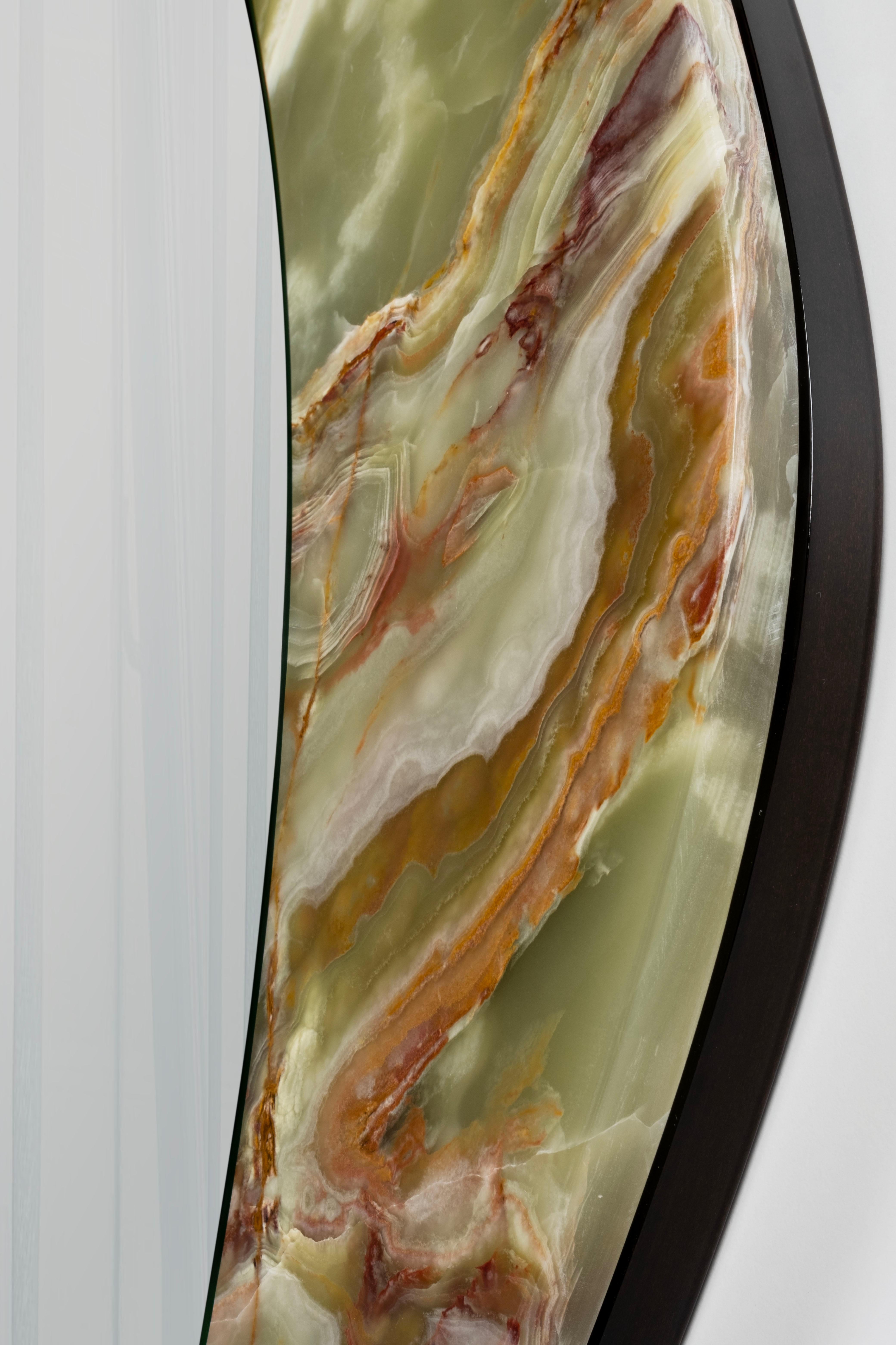 Wall Mirror Baila, Contemporary Collection, handcrafted in Portugal - Europe by Greenapple.

A stunning decorative wall mirror with a Green Onyx detail that adds a warm and inviting touch to any room, catching the eye of anyone who passes by
