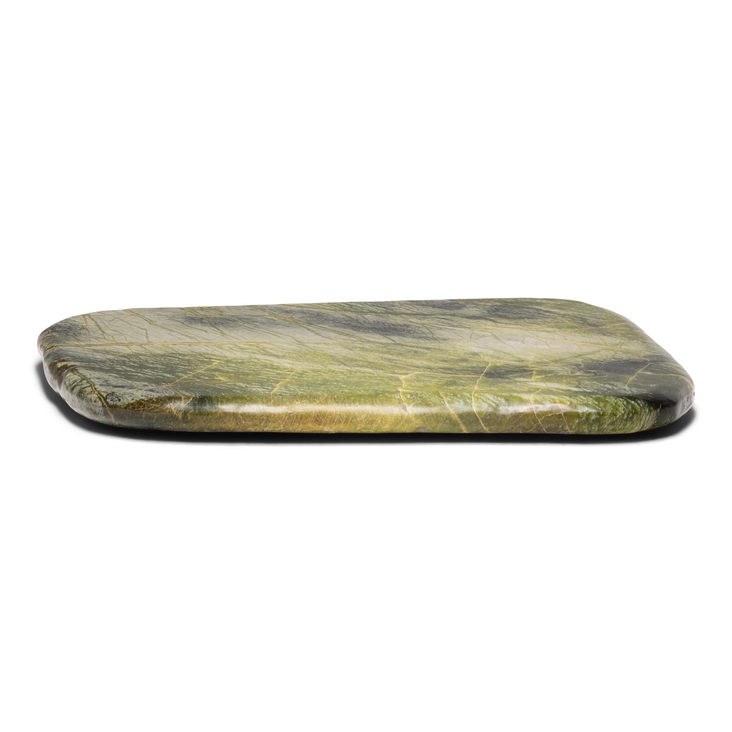 Found in China’s Liaoning province, greenery stones are named for the naturally occurring patterns suggestive of trees, grass and other plantlike forms that result from the stone’s conglomerate mix of jadeite, moss agate, serpentine, among other