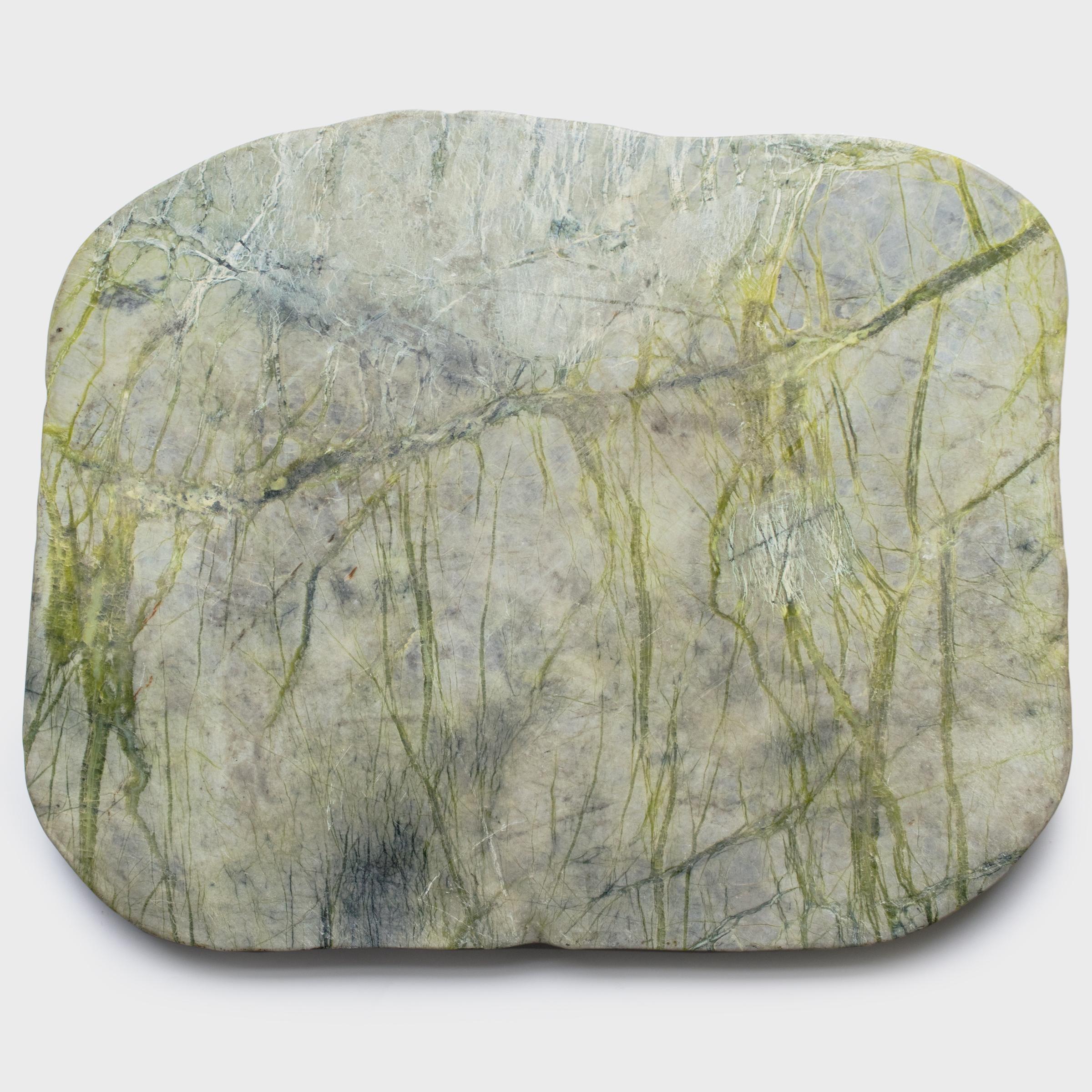 Found in China’s Liaoning province, greenery stones are named for the naturally occurring patterns suggestive of trees, grass and other plantlike forms that result from the stone’s conglomerate mix of jadeite, moss agate, serpentine, among other