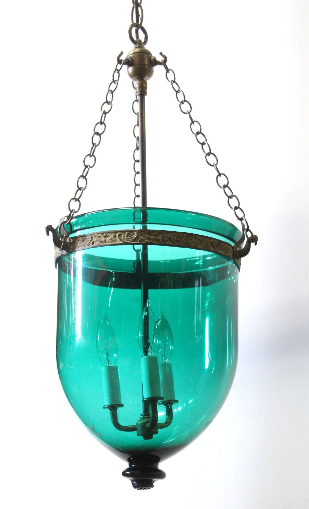 Early 20th century greenish blue hand made bell jar pendant light. Rewired with three new candelabra lights and new brass hardware. This can be seen at our 400 Gilligan St location in Scranton, PA.