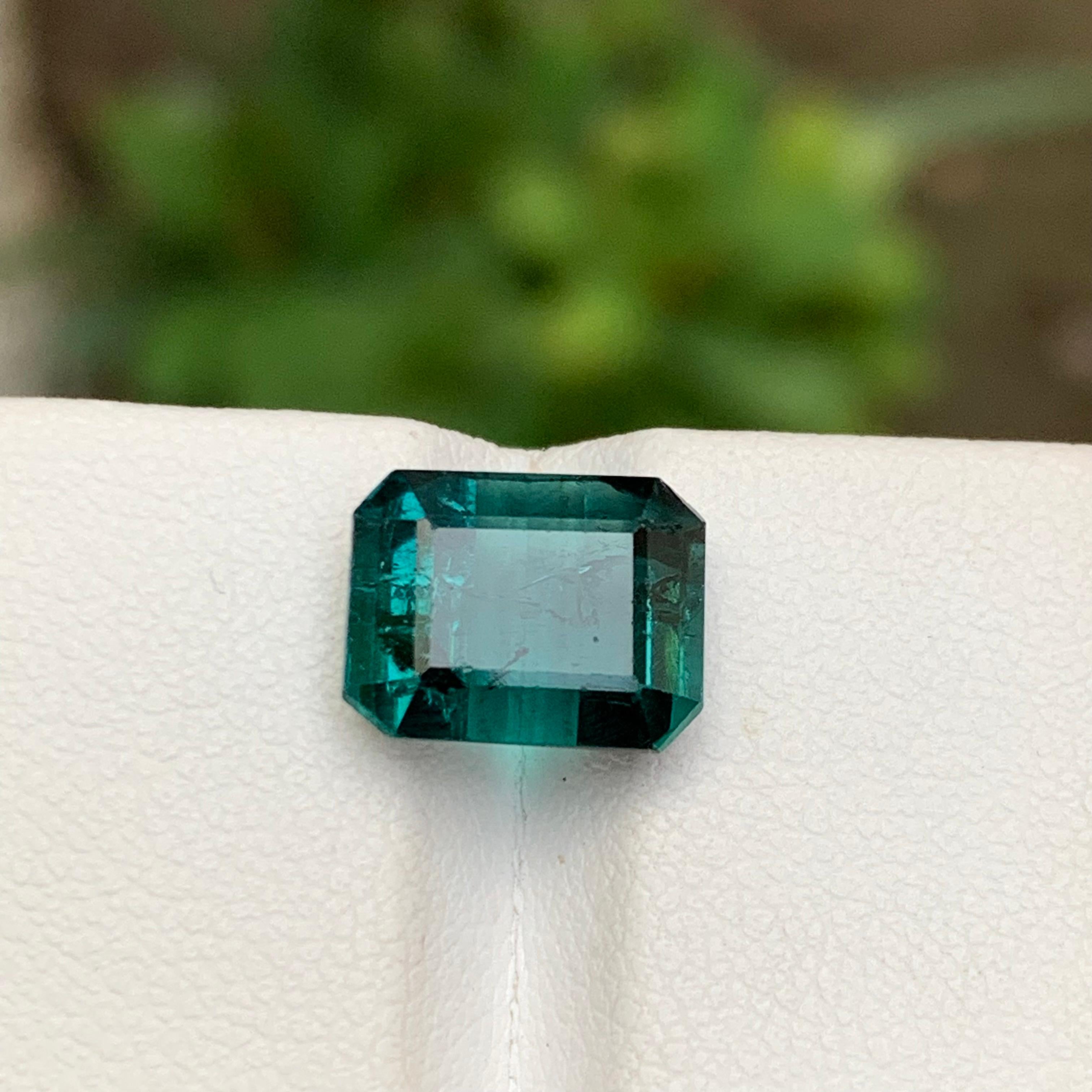 💎 GEMSTONE TYPE: Tourmaline
⚖️ WEIGHT: 4.95 Carats
🪚 SHAPE & CUT: Emerald Cut
📏 SIZE (MM): 8.22 x 10.49 x 6.36
🌈 COLOR: Indicolite Blue
🔎 CLARITY: Slightly Included 
🧪 TREATMENT: None (100% Natural)
🌍 ORIGIN: Kunar, Afghanistan 
💳