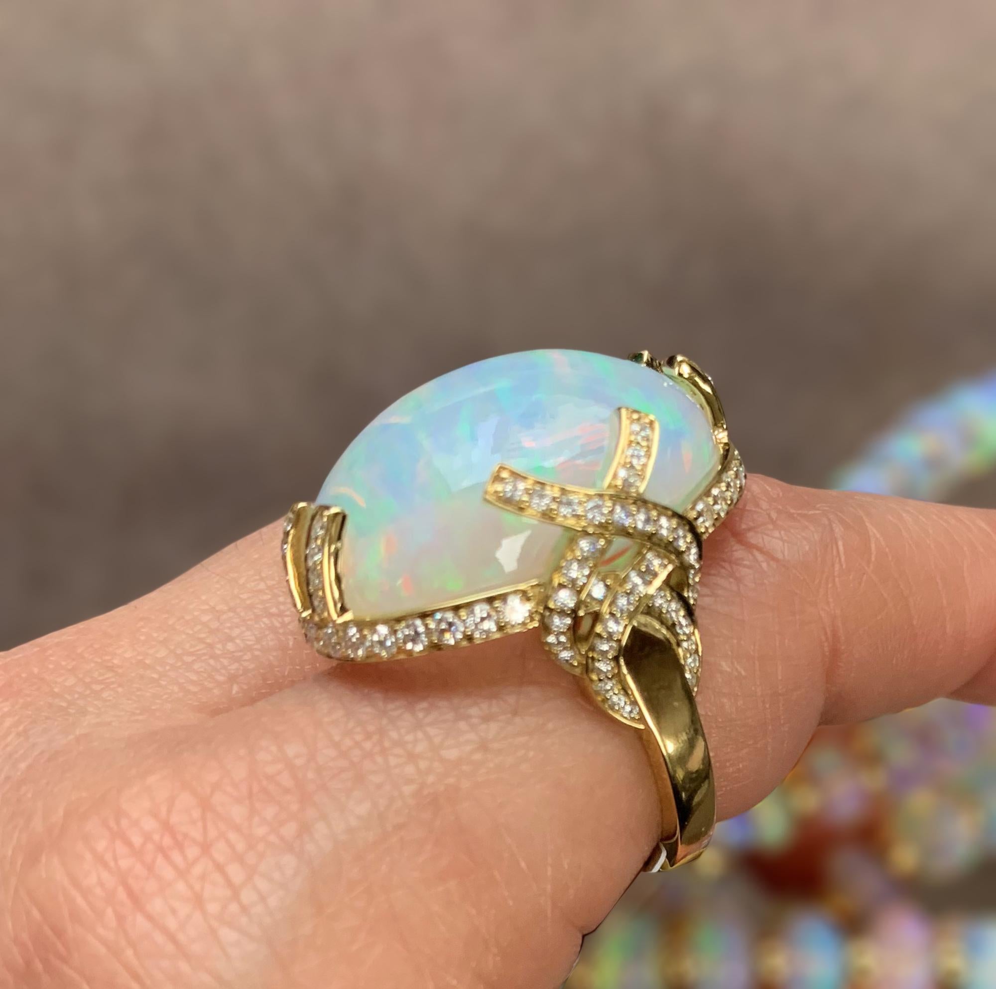 Greenish Medium Opal Oval Cabochon Ring With Diamonds in 18K Yellow Gold, from 'G-One' Collection    

Stone Size: 24 x 18 mm

Gemstone Approx Wt: 25.04 Carats

Diamonds: G-H / VS, Approx. Wt: 1.01 Carats