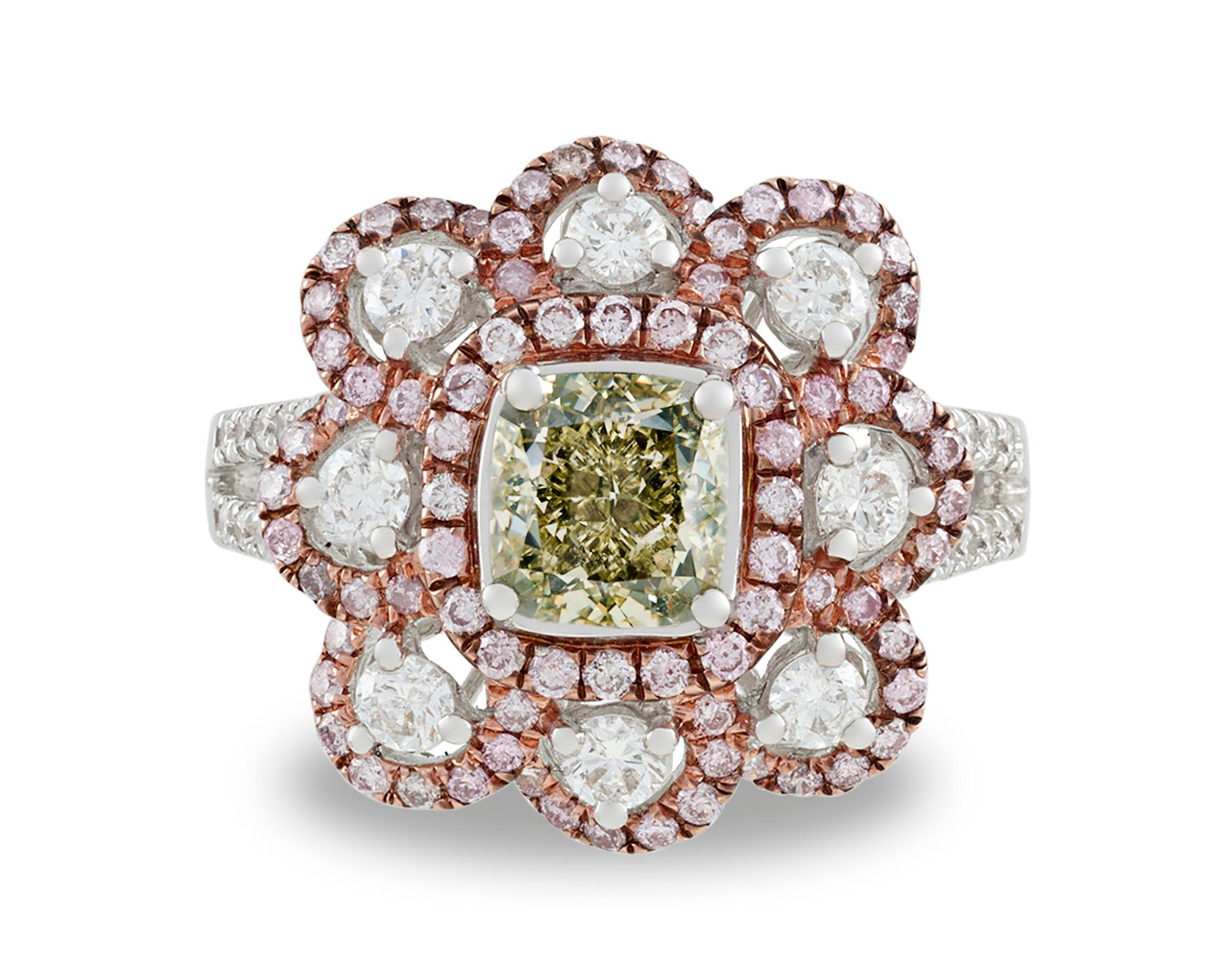 An exceptionally rare 1.50-carat fancy grayish greenish yellow diamond captivates the eye in this floral ring. Diamonds with a green hue are among the most coveted of all colored diamonds, prized for both their rarity and beauty. The delicate hue of