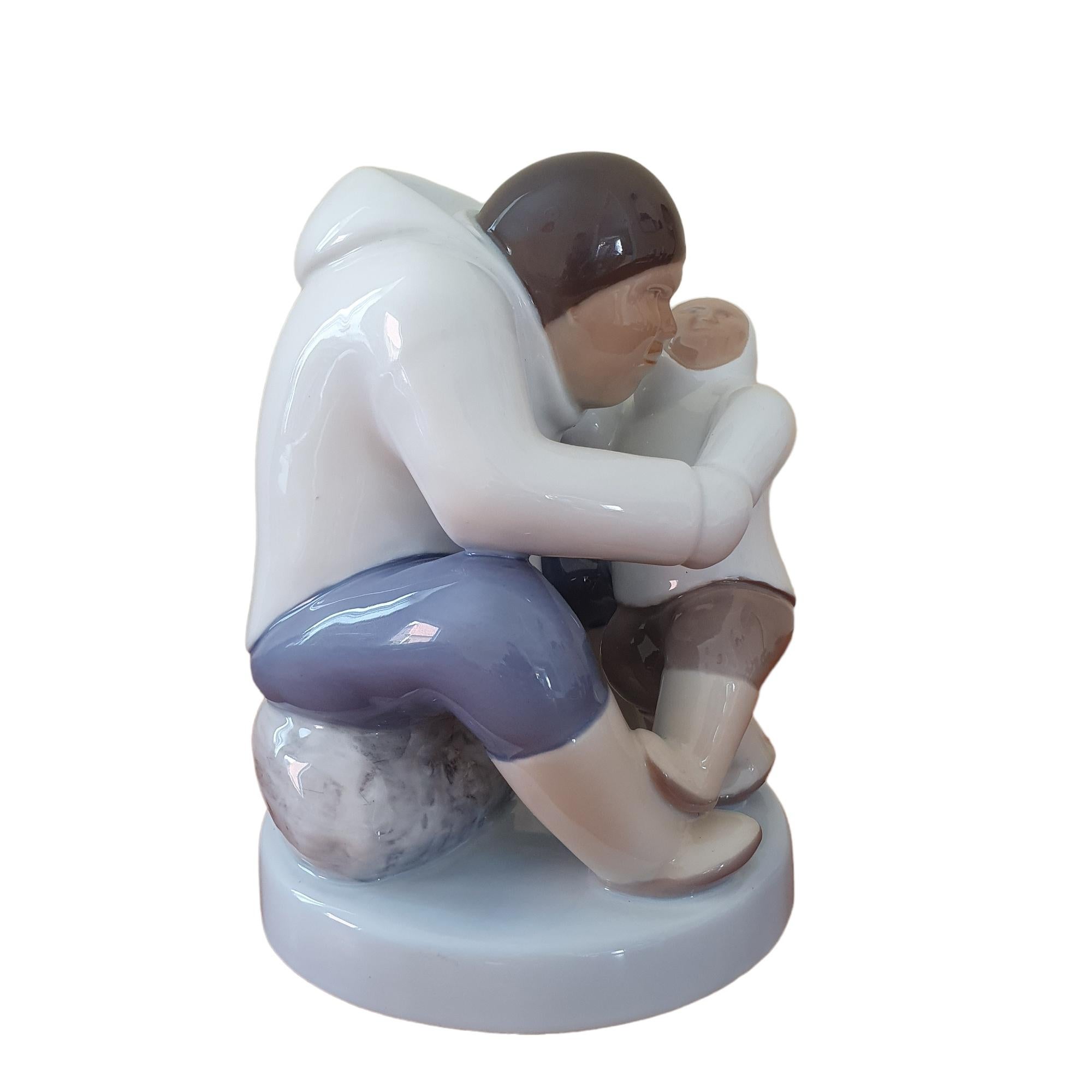 This relatively large Porcelain Figurine, designed by Karl Kristoffersen for Bing & Grøndahl is part of a series depicting Greenland and Inuit life. It is an homage to the indigenous people of Greenland to share with the rest of the world.

This