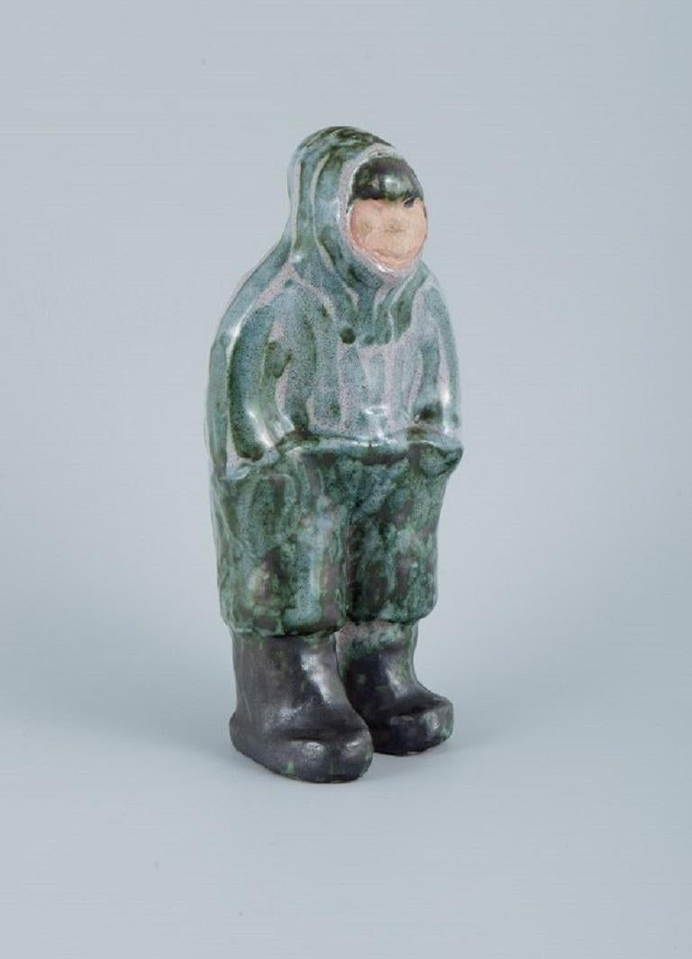 Greenlandica. Hand painted unique stoneware figure.
Inuit in traditional hunting clothes.
circa. 1970s.
In perfect condition.
Signed illegibly.
Dimensions: W 9.0 x H 20.5 cm.
