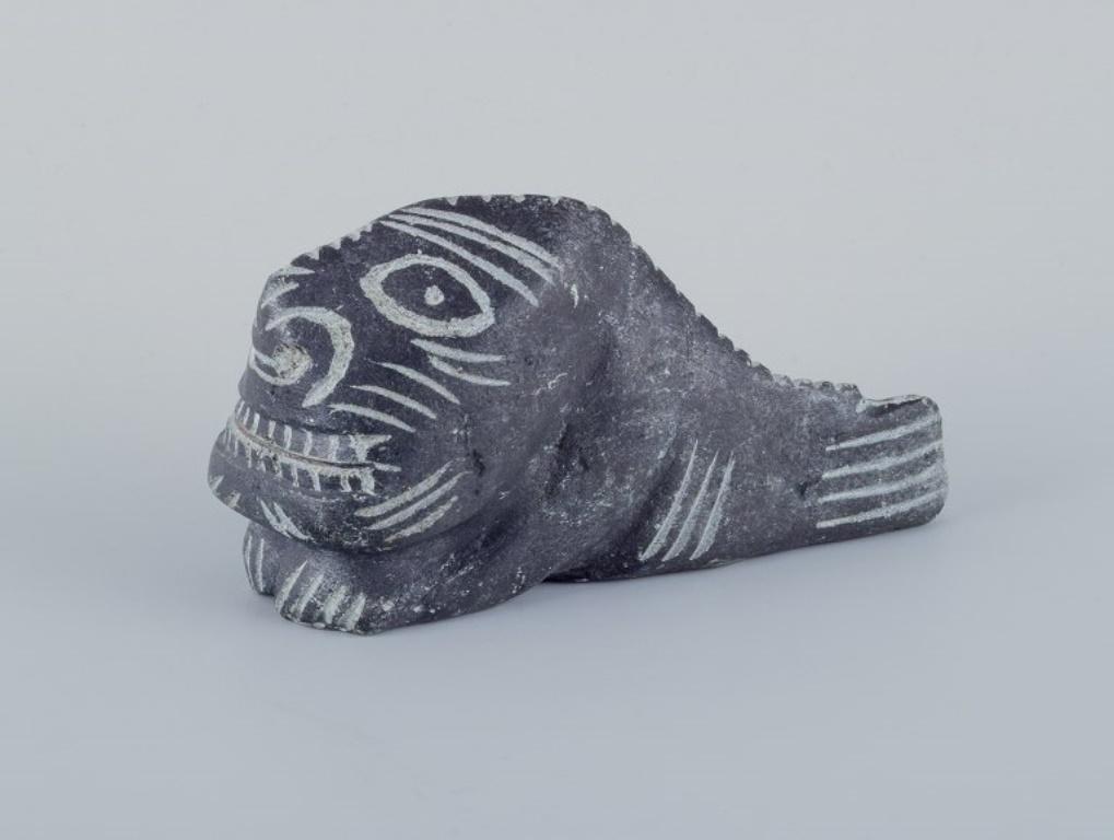 Greenlandica, Jakob Keke, Kungmiut, East Greenland.
Sculpture in soapstone.
Approximately from the 1970s.
In excellent condition.
Label.
Dimensions: L 14.5 cm x H 7.5 cm x W 5.5 cm.
