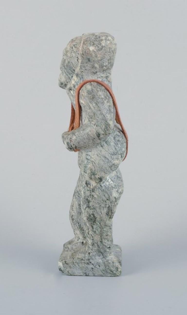 Folk Art Greenlandica, old hunter with a seal on his back, sculpture in soapstone. For Sale