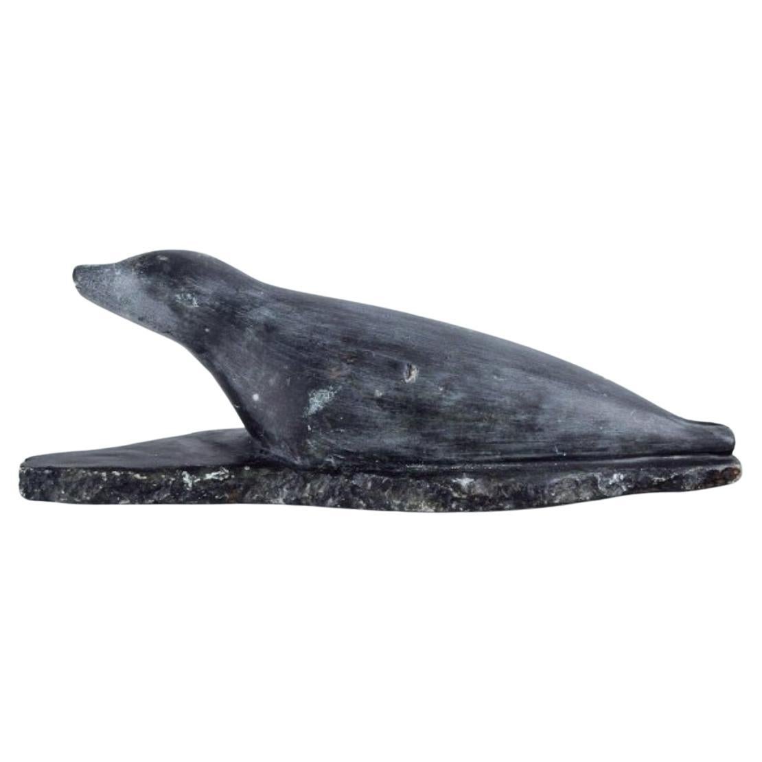 Greenlandica, Ortôrak, large sculpture of a lying seal made of soapstone. 
