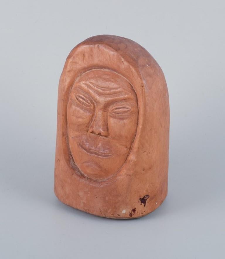 Folk Art Greenlandica, wooden sculpture of a hunter in profile. Hand-carved. Mid-20th C. For Sale