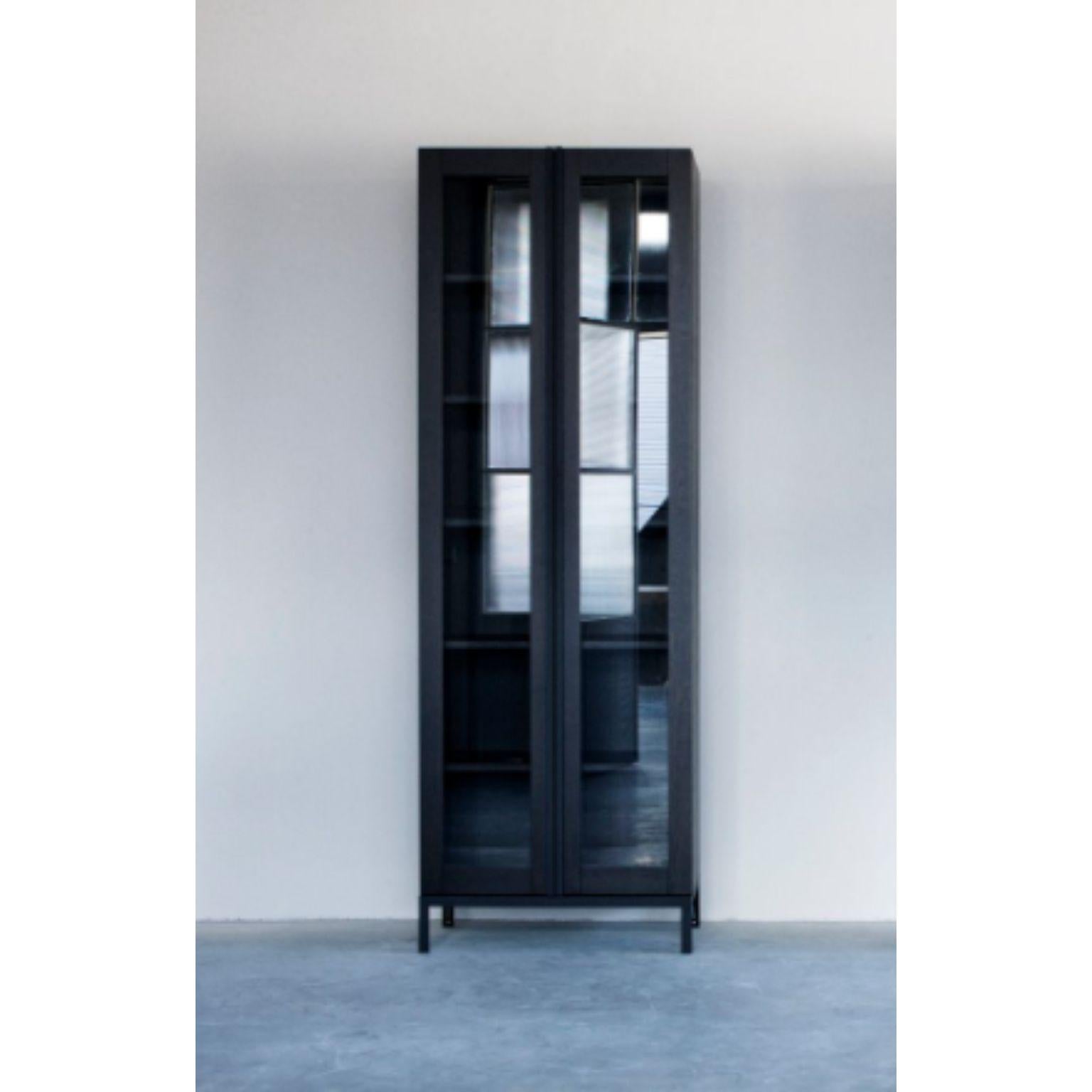 Greep cabinet with glass doors by Van Rossum
Dimensions: D76 x W41 x H226 cm
Materials: Oak, steel, glass.

The wood is available in all standard Van Rossum colors, or in a matching finish to customer’s own sample.
The steel frames are