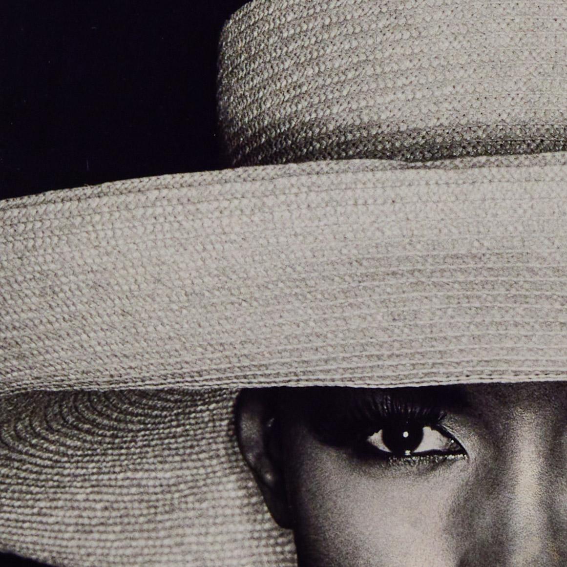 Grace with Hat - Beige Portrait Photograph by Greg Gorman