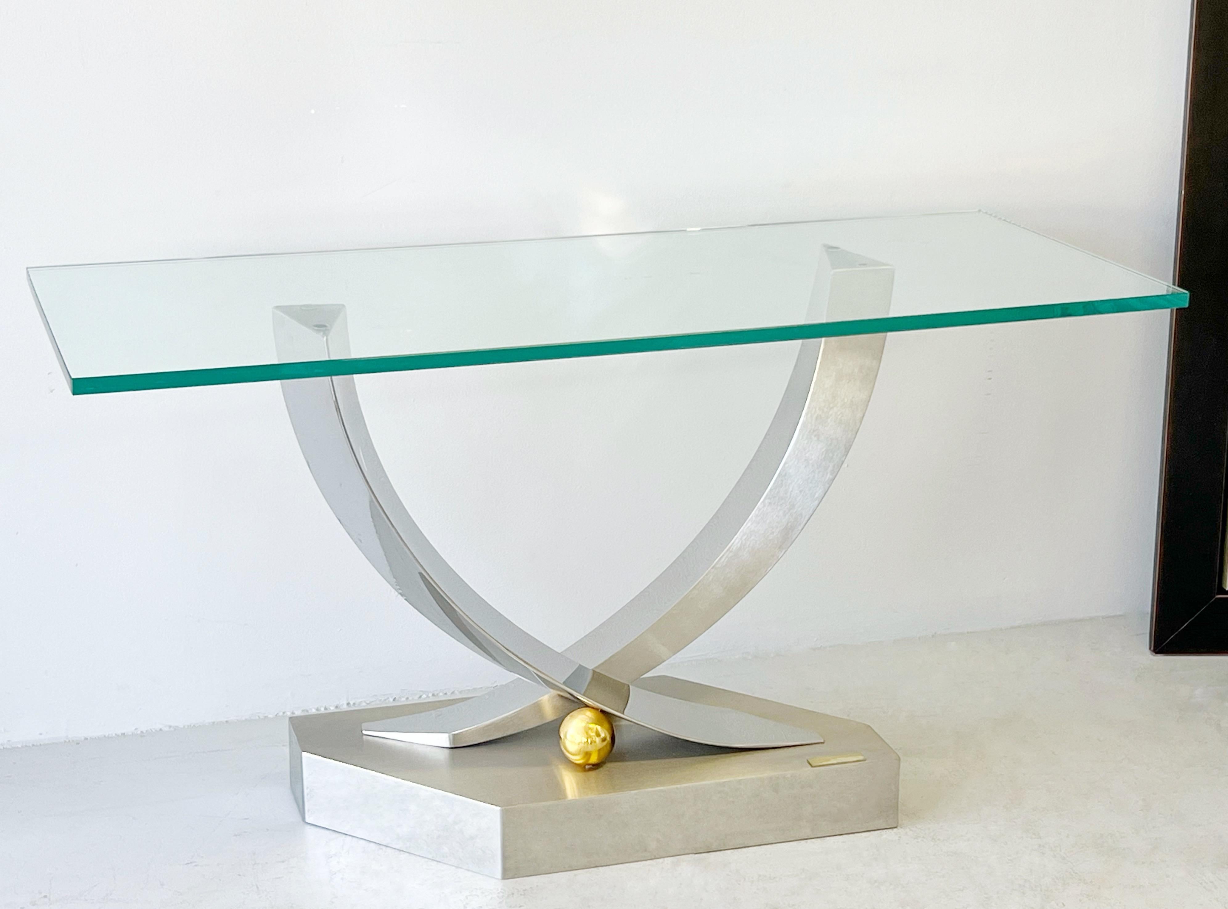 Stainless Steel with brass console table with glass top. Signed and numbered. 