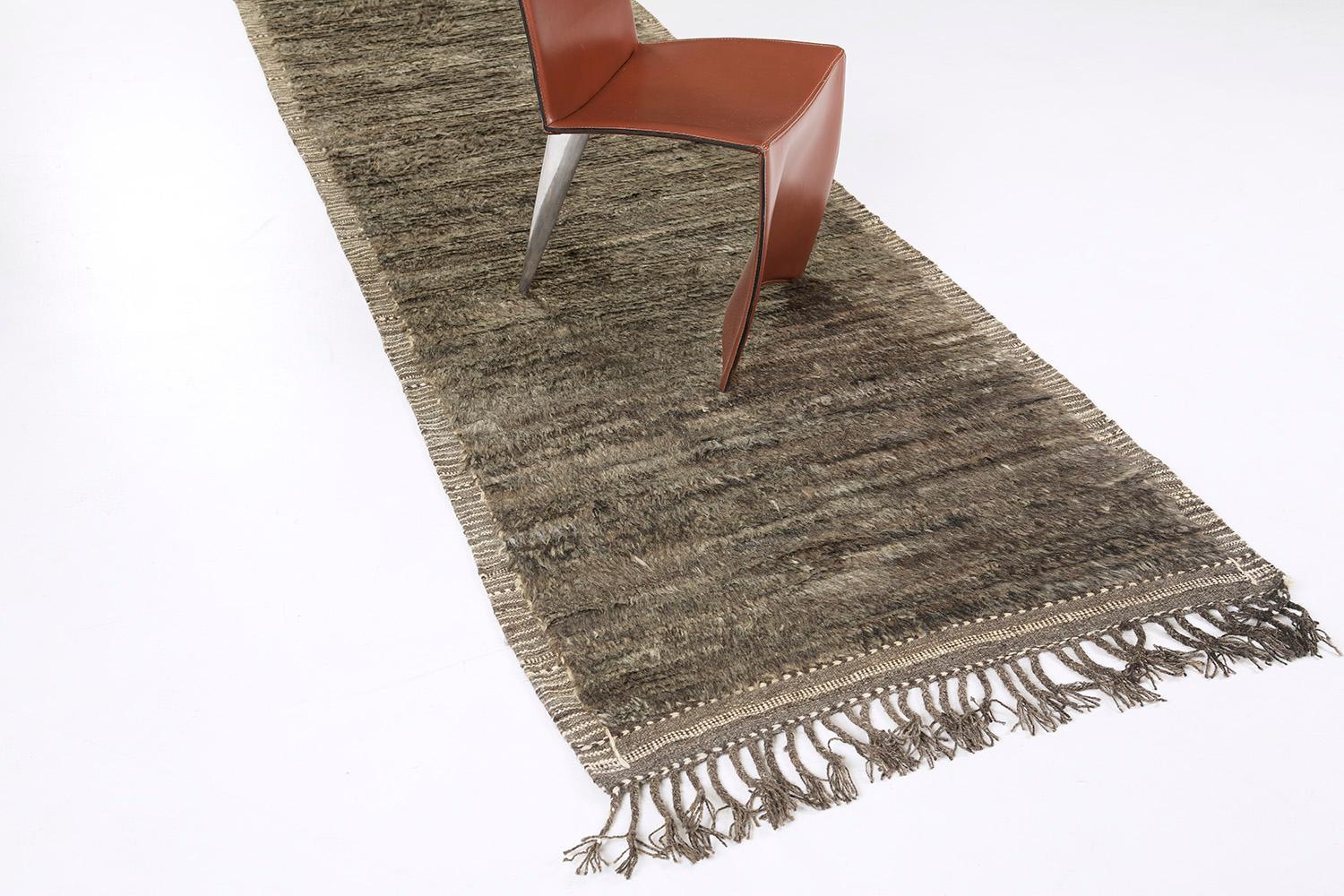 The perfect sandy color handwoven wool area rug to accommodate many spaces. This timeless design was built to withstand high amounts of foot traffic. The Haute Bohemian collection is designed in Los Angeles and named for the winds knitting together