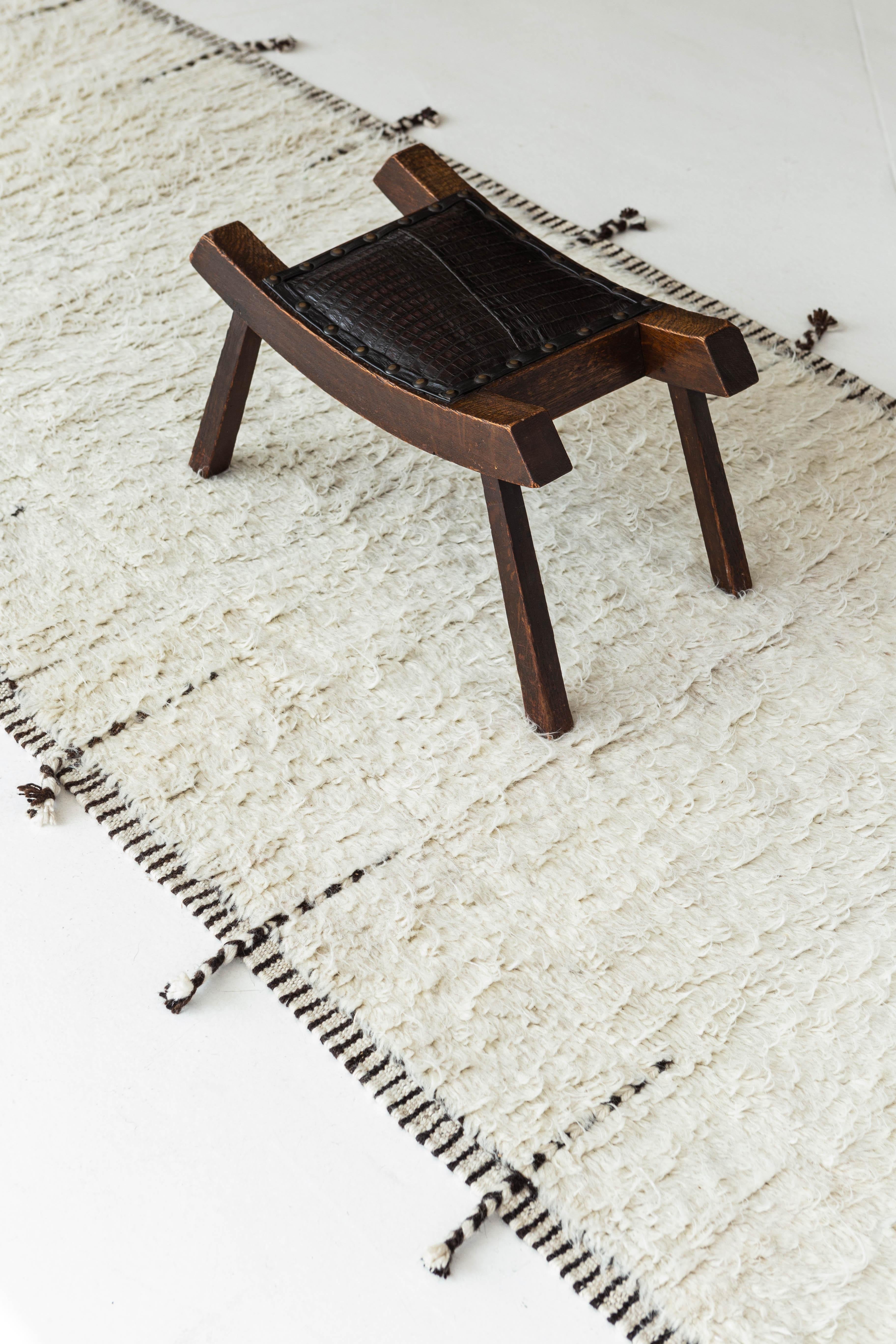 The perfect ivory color handwoven wool area rug to accommodate many spaces. This timeless design was built to withstand high amounts of foot traffic. The Haute Bohemian collection is designed in Los Angeles and named for the winds knitting together