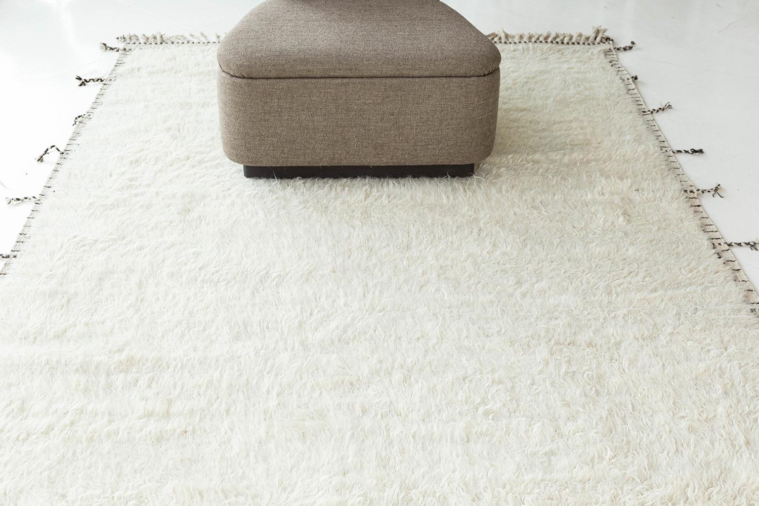 The perfect ivory color handwoven wool area rug to accommodate many spaces. This timeless design was built to withstand high amounts of foot traffic. The Haute Bohemian collection is designed in Los Angeles and named for the winds knitting together
