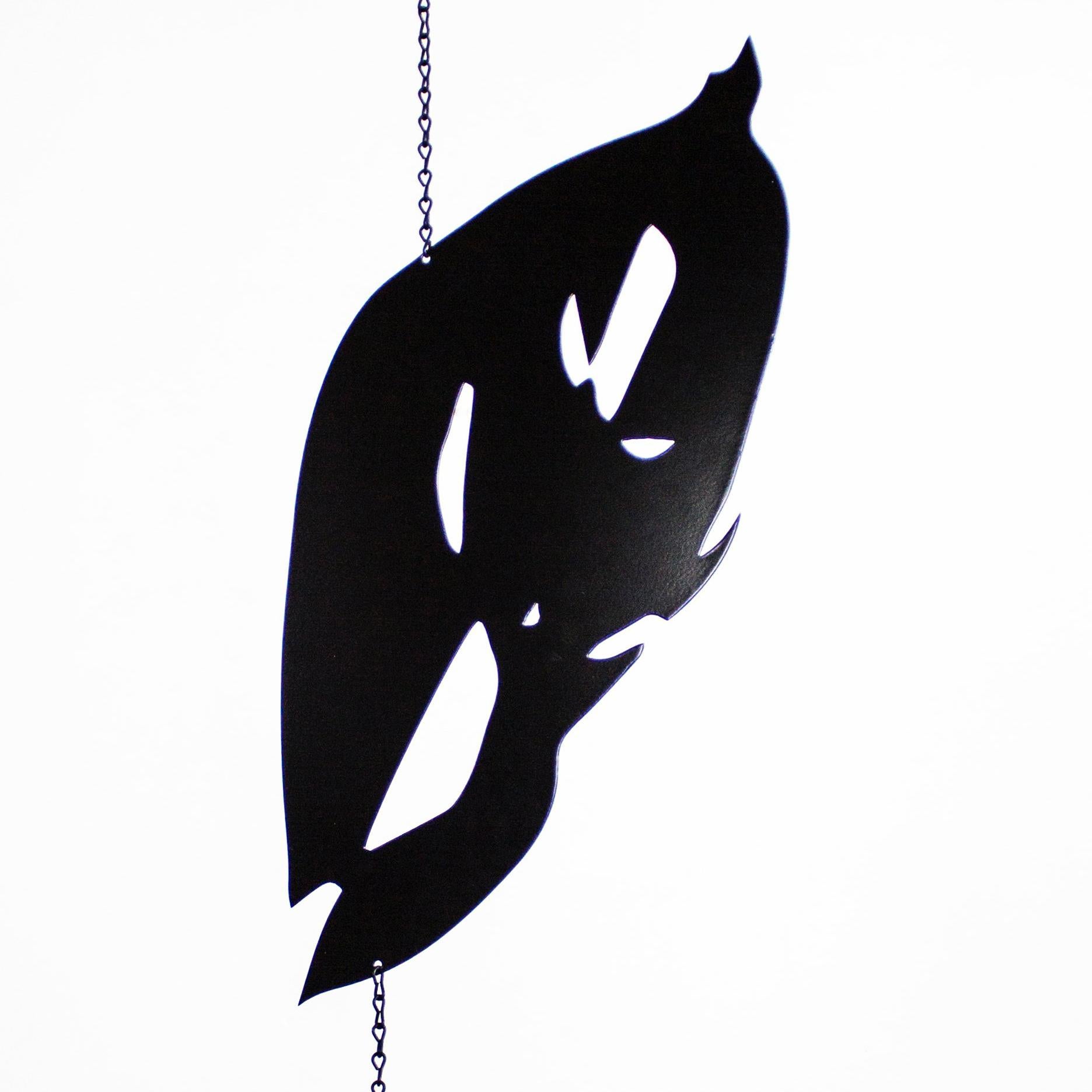 Mobile sculpture of black  leaves made up of powder coated aluminum.