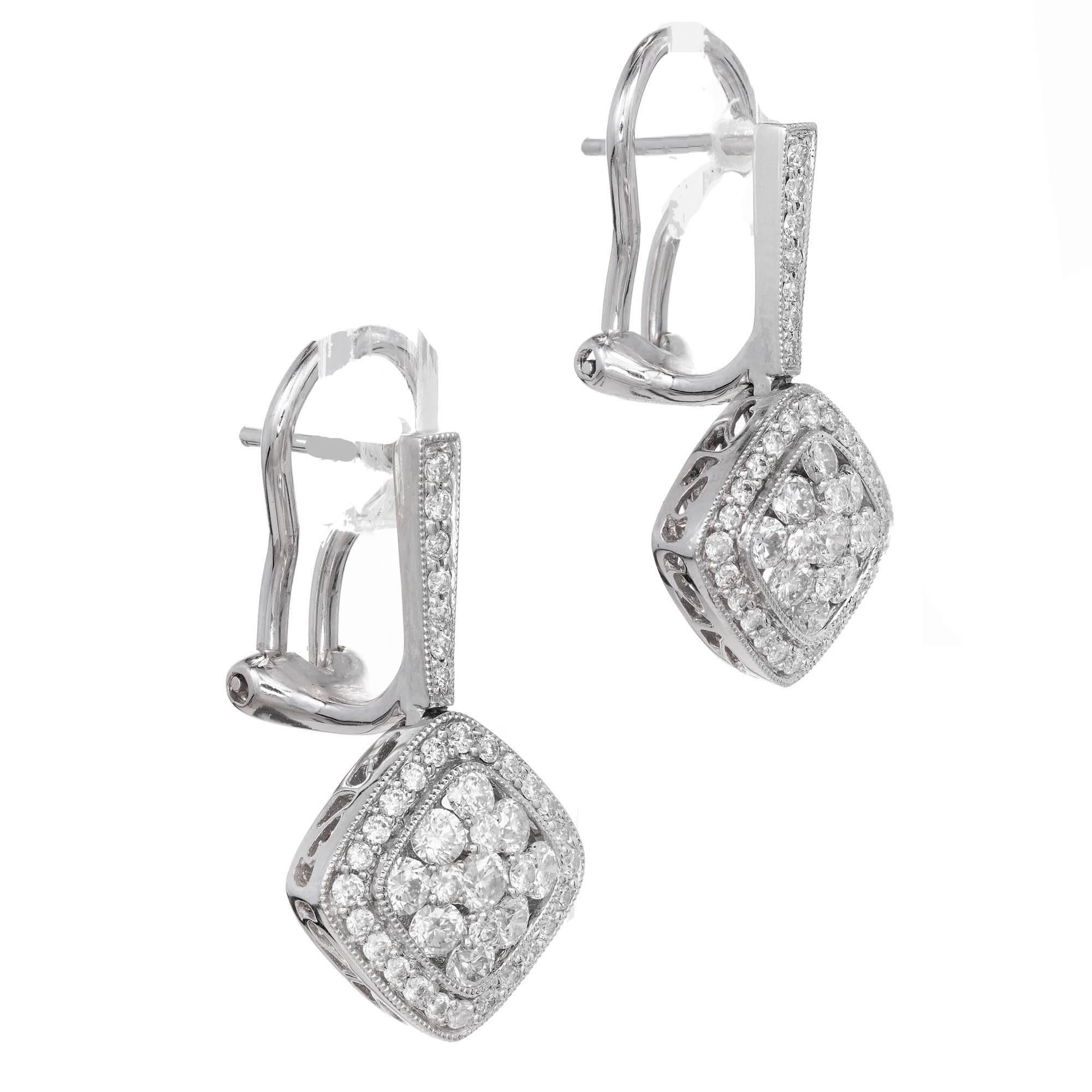 Gregg Ruth Diamond cluster dangle earrings in 18k white gold with bright white full cut Diamonds.

88 round full cut Diamonds, approx. total weight 1.20cts, F – G, VS2 – SI1 
18k white gold 
Tested: 18k 
Stamped: K18 
Hallmark: Gregg Ruth D1.20 
6.9