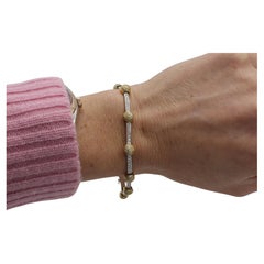 Gregg Ruth Bracelet tennis ligne en or bicolore 18 carats et diamants naturels