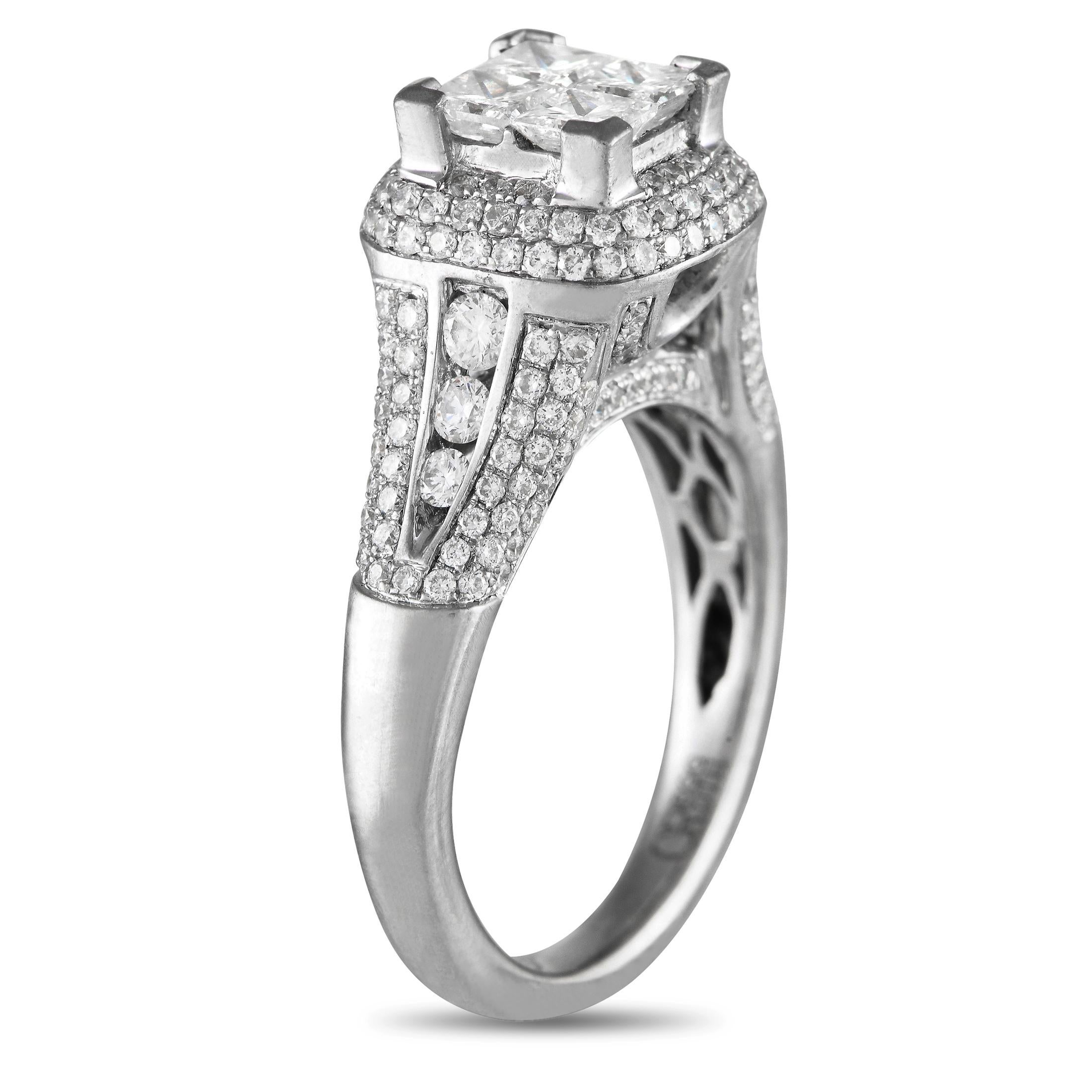 A dazzling arrangement of Diamonds with a total weight of 1.85 carats make this ring impossible to ignore. This pieces stunning 18K White Gold setting features a 1mm wide band and a bold 10mm top height.This jewelry piece is offered in estate