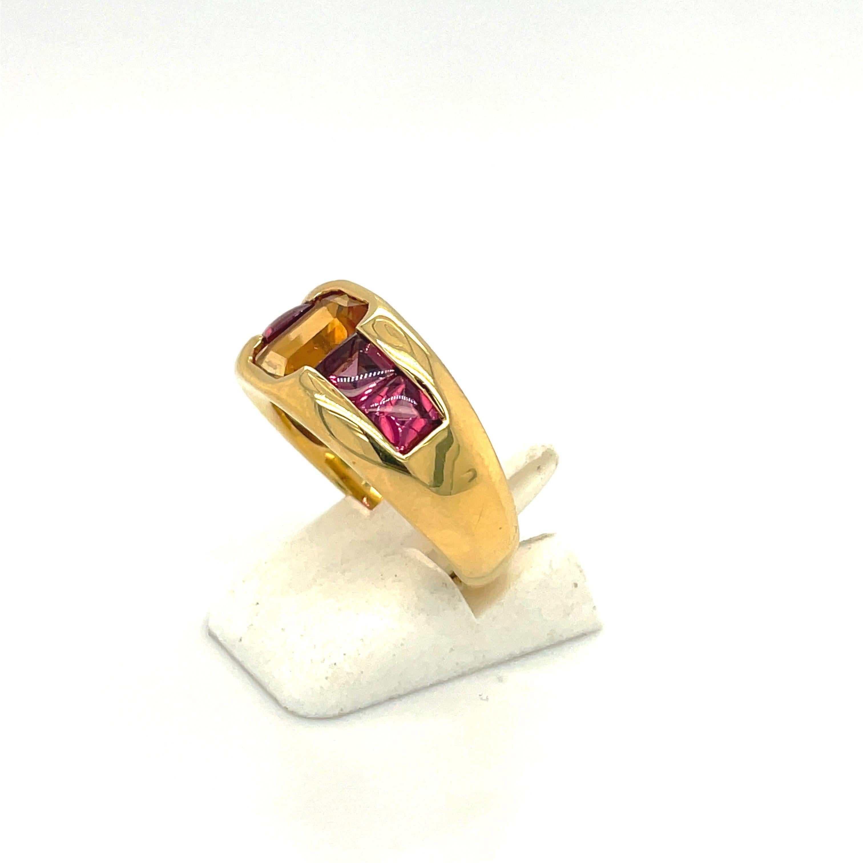 Designed by Gregg Ruth , this 18 karat yellow gold band style ring is set with an emerald cut citrine center stone. Four square cut rhodolite stones flank the center citrine in this happy and bright color combination ring.
Citrine=1.34