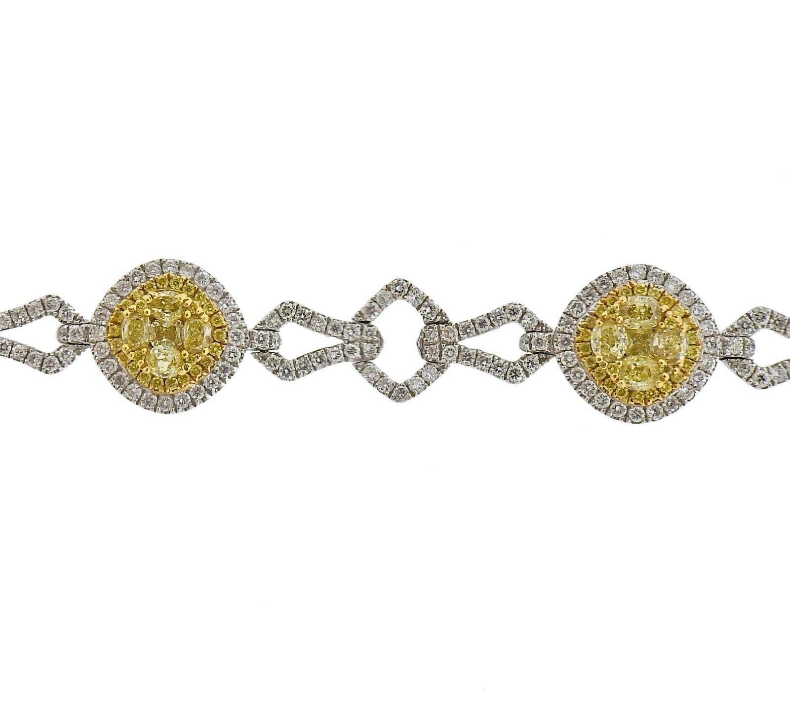 18k white gold bracelet by Gregg Ruth. Set with 3.53ctw of VS-Si/ fancy yellow diamonds, and 2.57ctw of VS-SI/H diamonds. Bracelet is 7.5