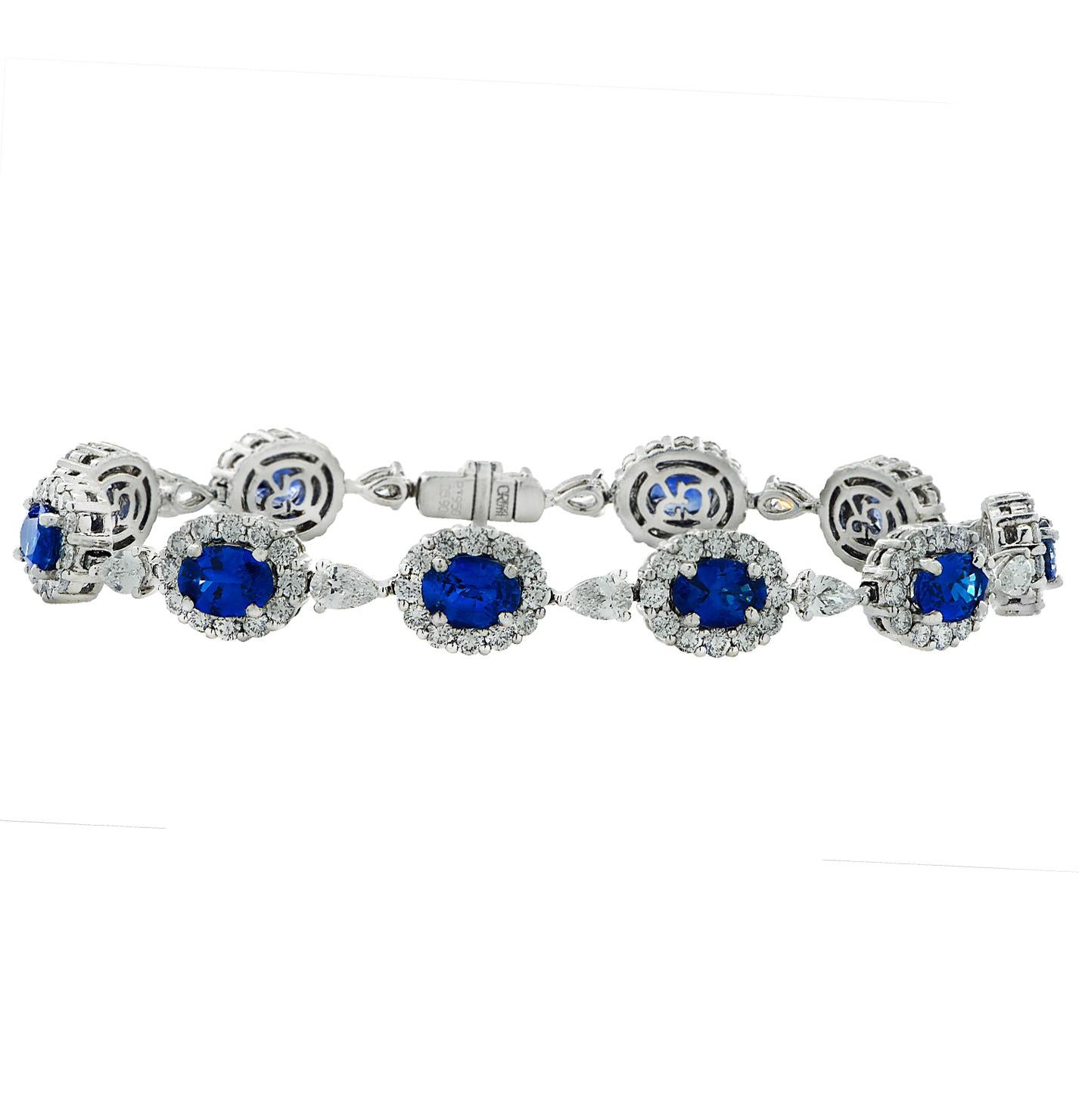 Stunning Gregg Ruth Diamond and Sapphire bracelet crafted in platinum, featuring 13 oval sapphires weighing approximately 5.90 carats total, 13 pear shape diamonds and round brilliant cut diamonds weighing approximately 5.90 carats total, G-H color,
