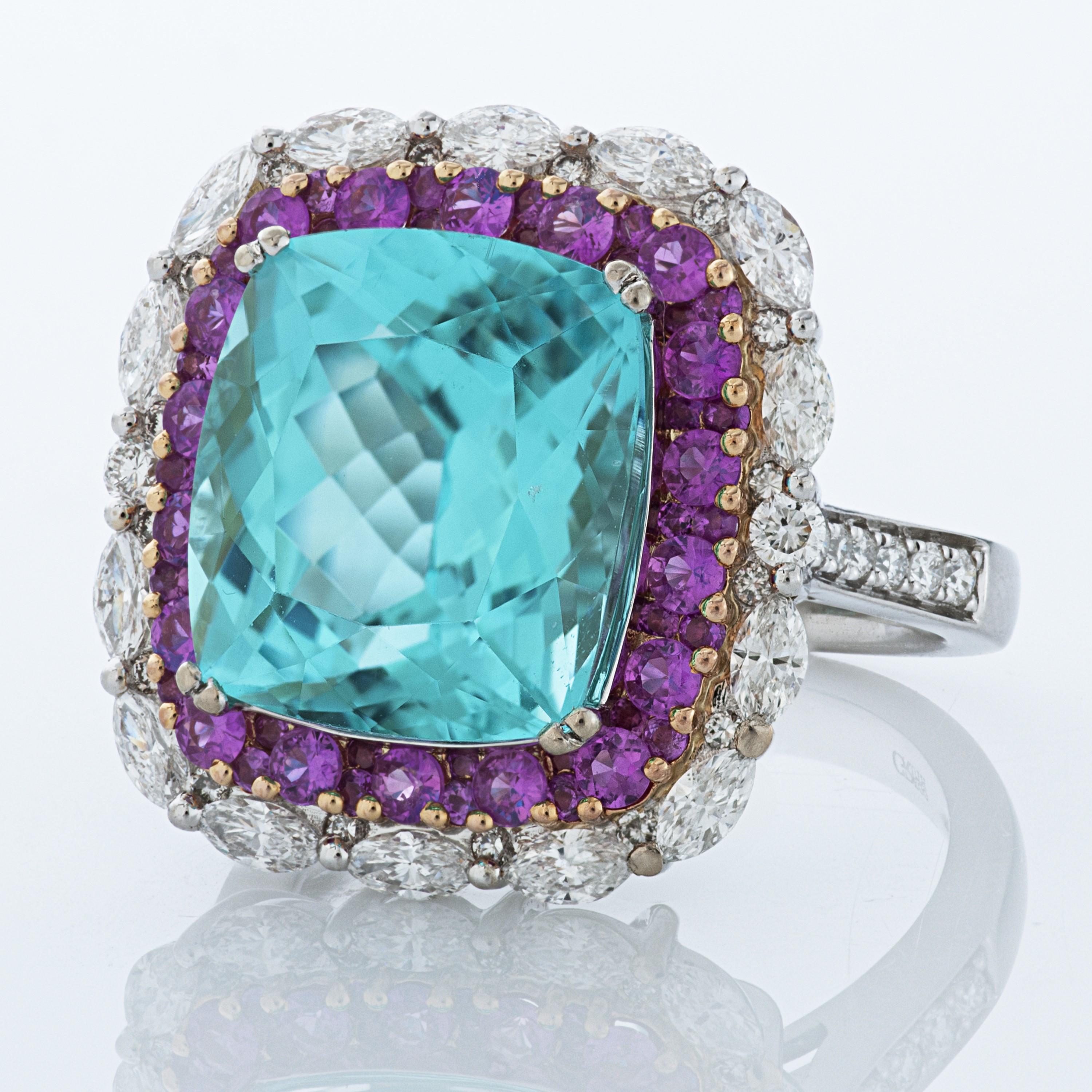 Gregg Ruth Atrium Collection Paraiba tourmaline, pink sapphire and diamond 18kwg ring accompanied by an AGL report and a Gregg Ruth certificate of authenticity.

The center stone of this ring is a cushion cut 7.73 carat Mozambique Paraiba tourmaline