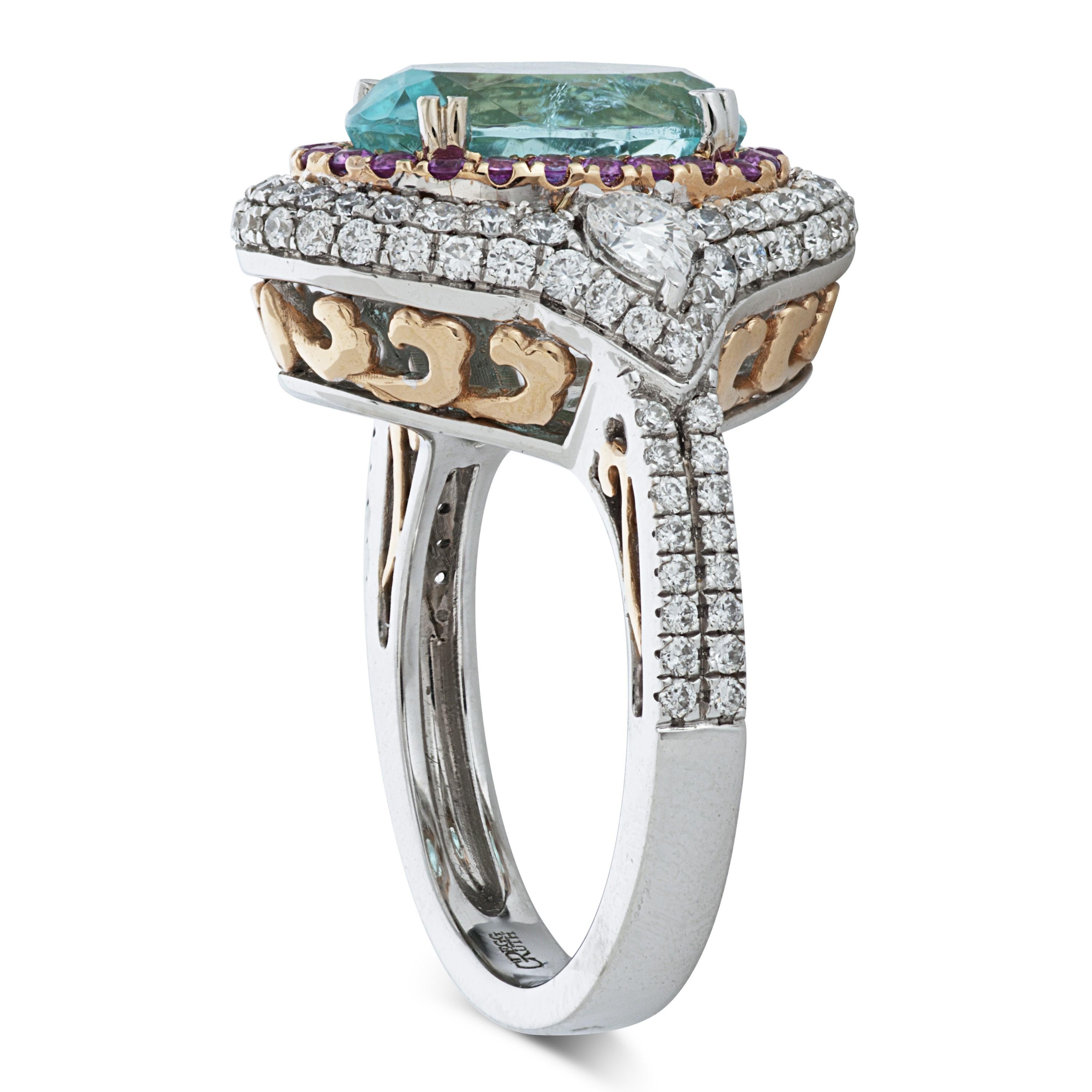 Gregg Ruth Atrium Collection Paraiba tourmaline, pink sapphire and diamond 18k white gold ring accompanied by an AGL report and a Gregg Ruth certificate of authenticity.

This Gregg Ruth ring features an oval shaped 3.81 carat Mozambique Paraiba