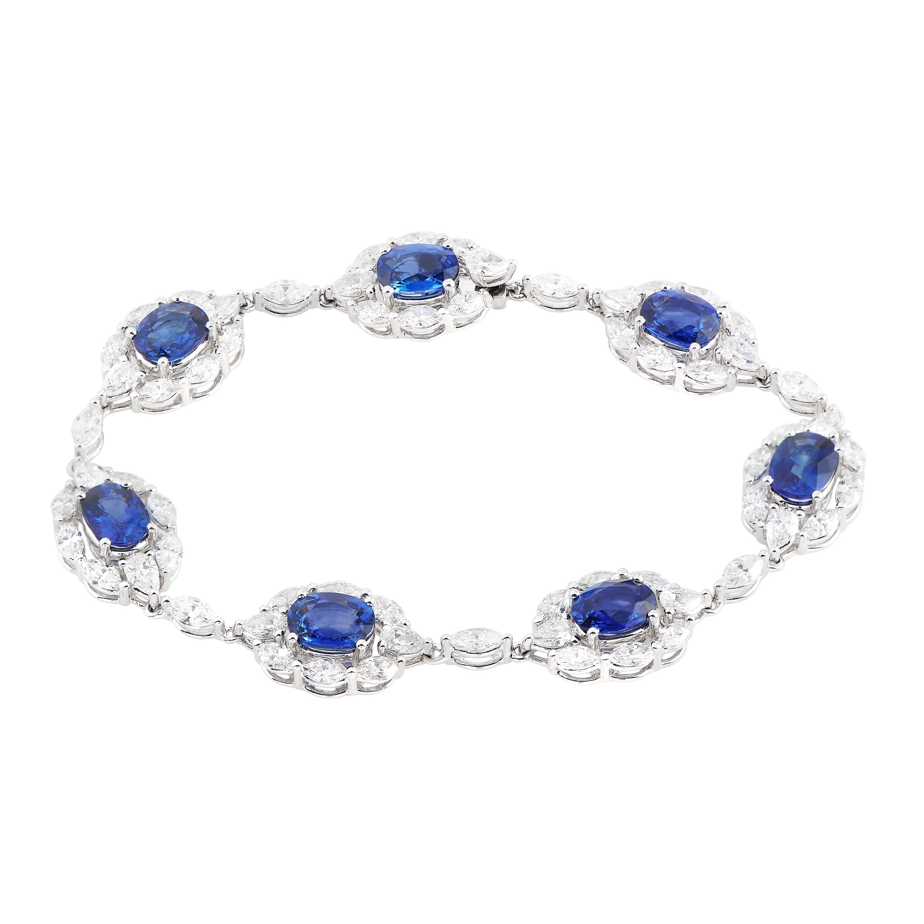 Experience the allure of this extraordinary sapphire and diamond halo bracelet, meticulously crafted by the renowned Greg Ruth.

The 7 oval sapphires weigh a total of ~11.80 carat. There are 64 marquise shape diamonds that weigh ~6.10 total carat;
