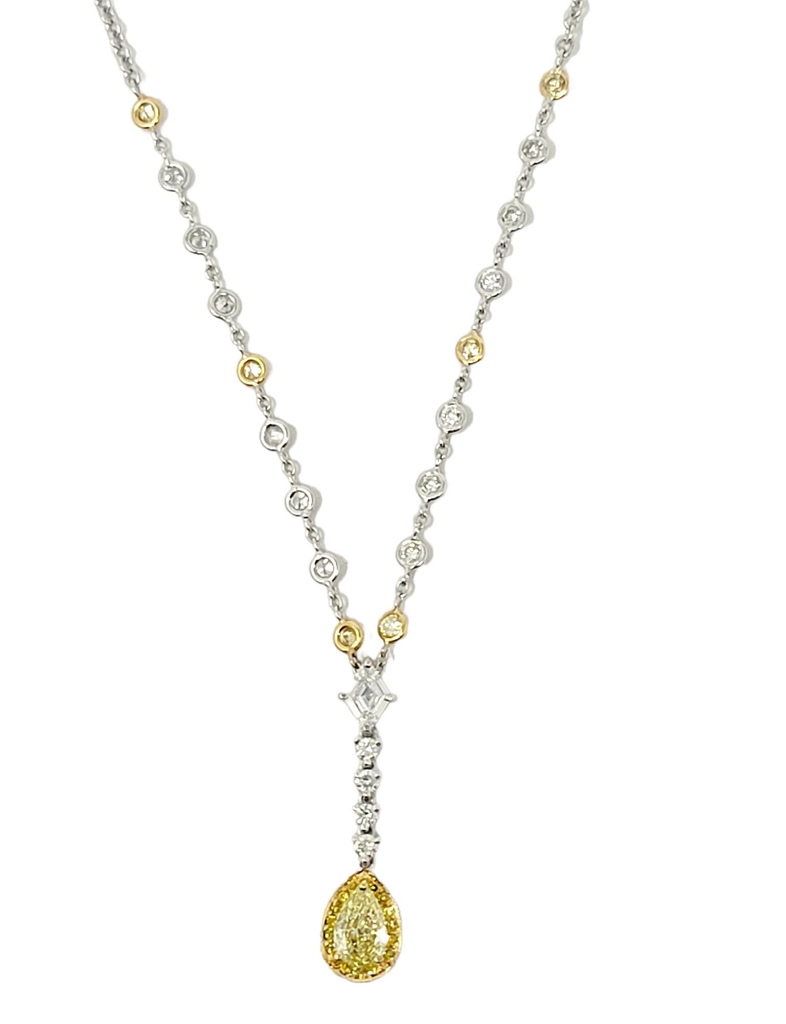 This absolutely gorgeous Gregg Ruth diamond drop necklace is simple but elegant. Featuring two-toned diamonds and gold, this delicate piece enhances anything that it is paired with. A simple white gold chain is accented by round bezel set yellow and